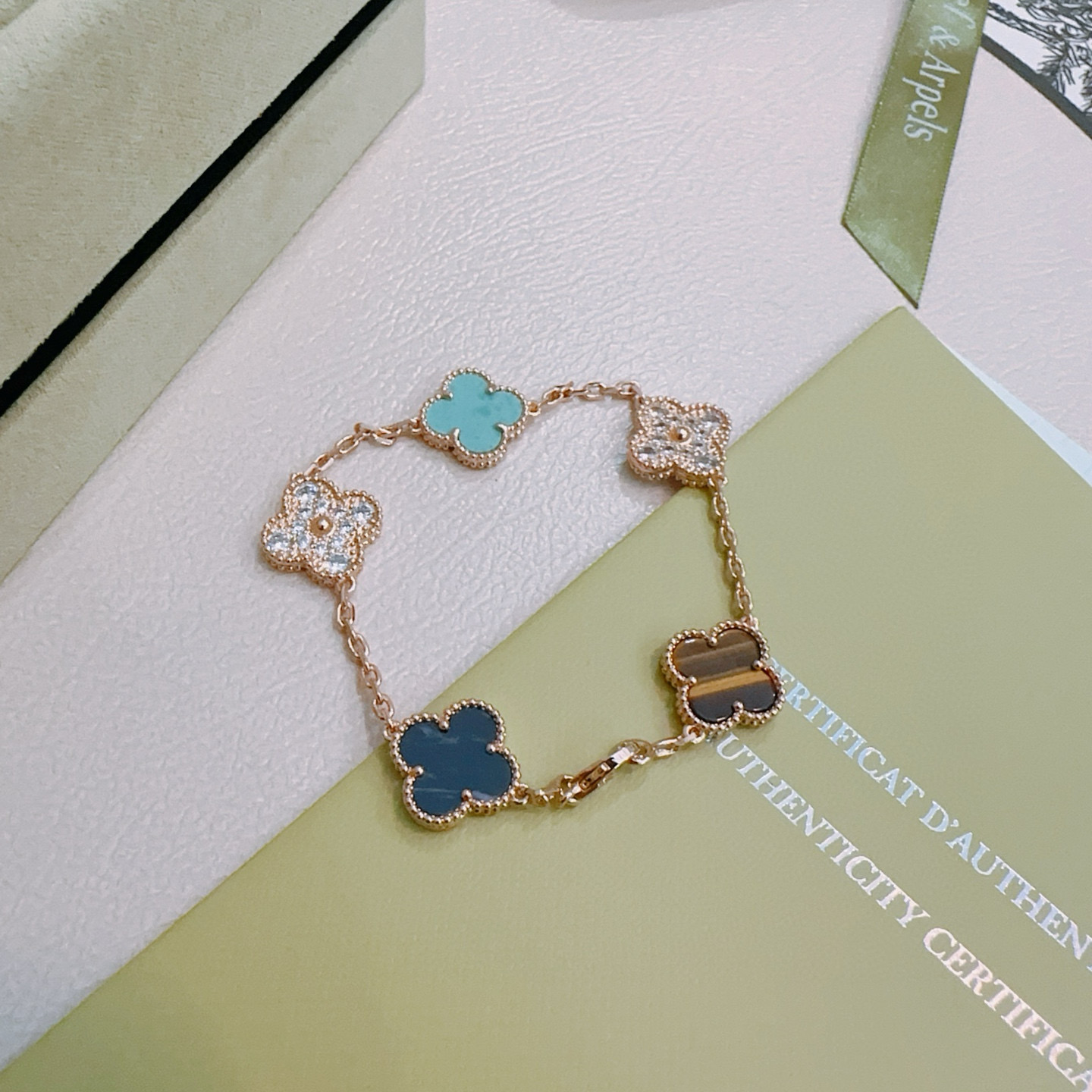Van Cleef Arpels Alhambra bracelet Rose gold with turquoise dark blue stone tiger s eye and clear diamond accents 18cm