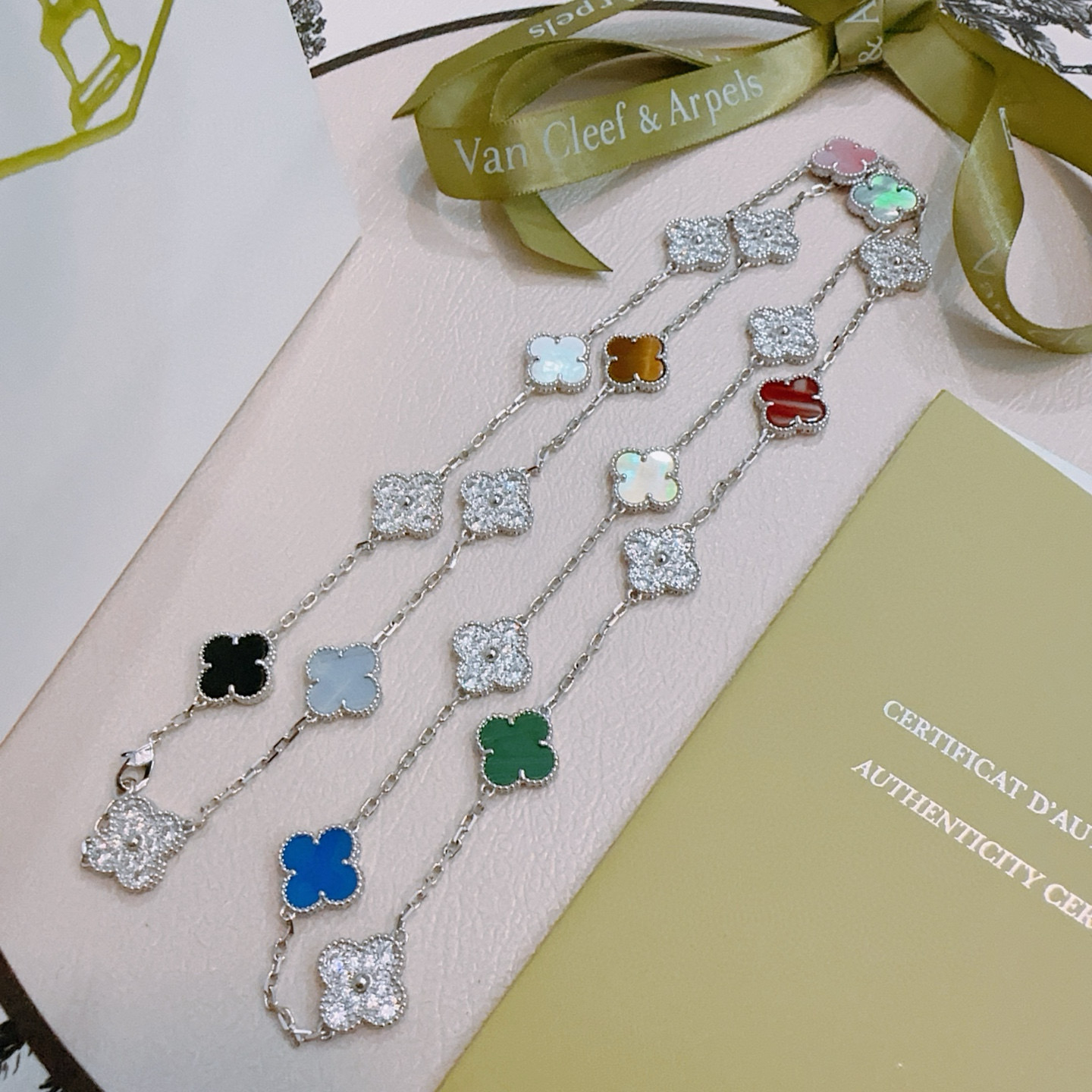 Van Cleef Arpels Alhambra necklace Silver-toned metal with multicolor stones including black onyx gray chalcedony diamond-pave tiger s eye white mother-of-pearl pink mother-of-pearl red carnelian gray mother-of-pearl cream mother-of-pearl green malachite blue agate pink opal green mother-of-pearl 80cm