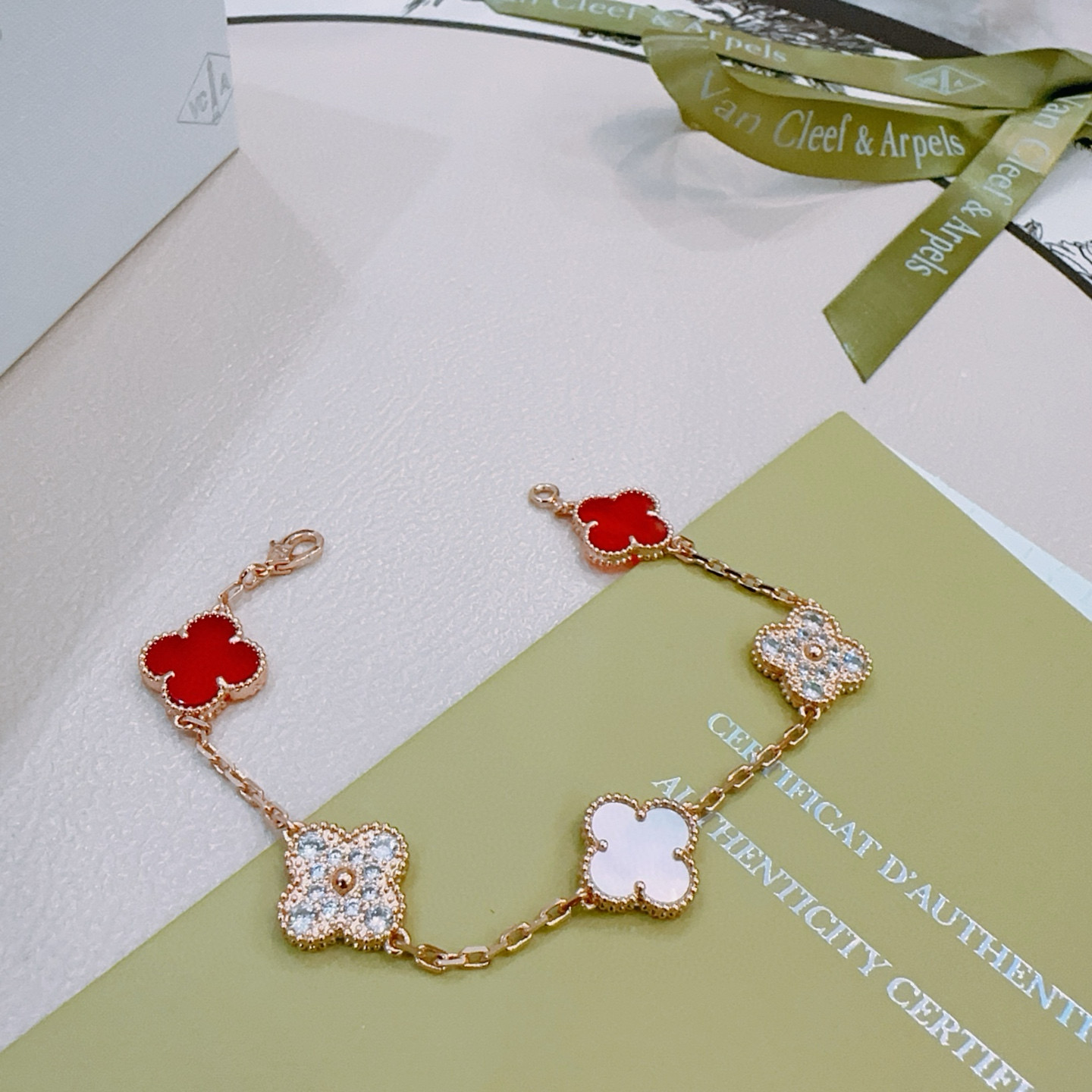 Van Cleef Arpels Alhambra bracelet Rose gold metal with red carnelian white mother-of-pearl and clear diamond accents 19cm