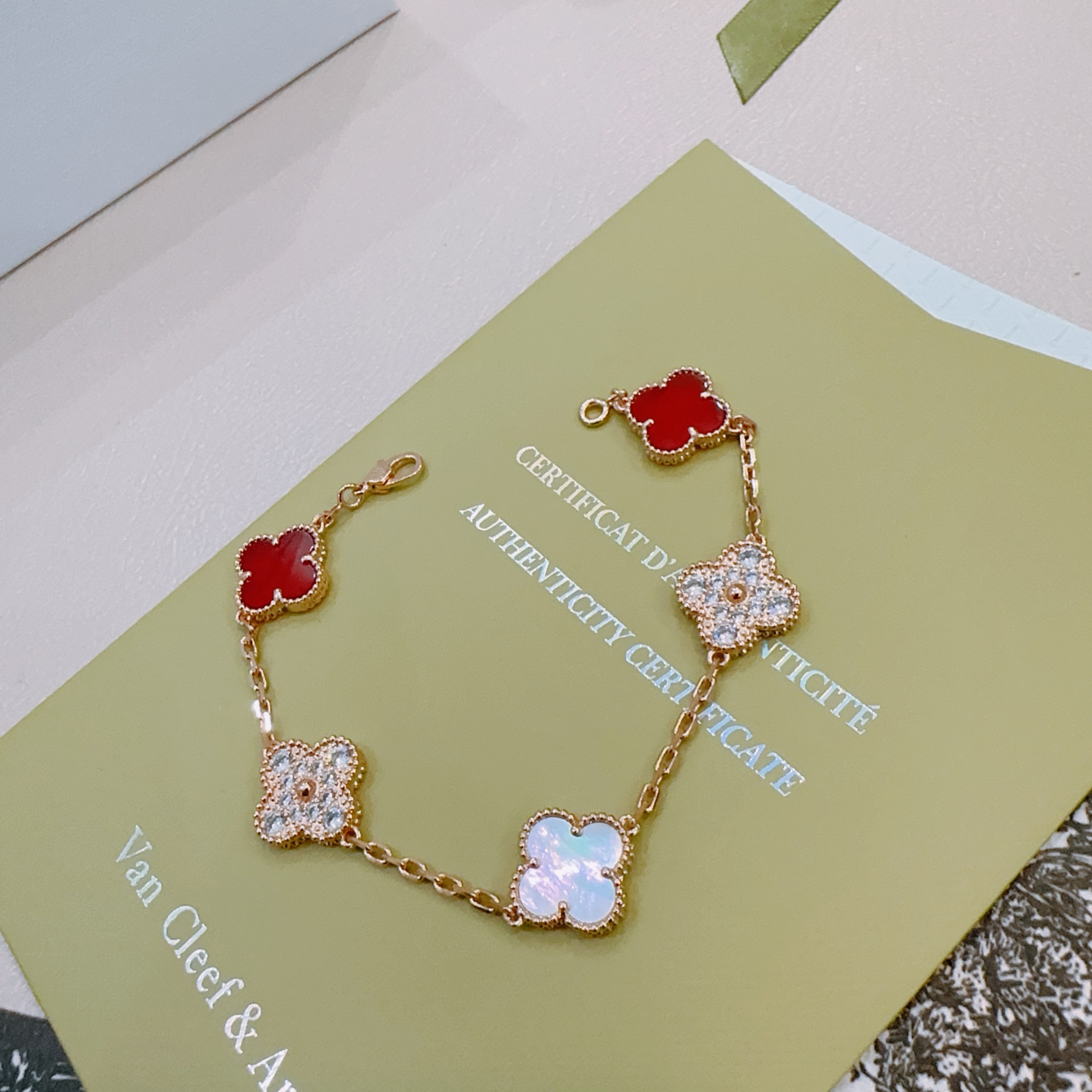Van Cleef Arpels Alhambra bracelet Rose gold metal with red carnelian white mother-of-pearl and clear diamond accents 19cm