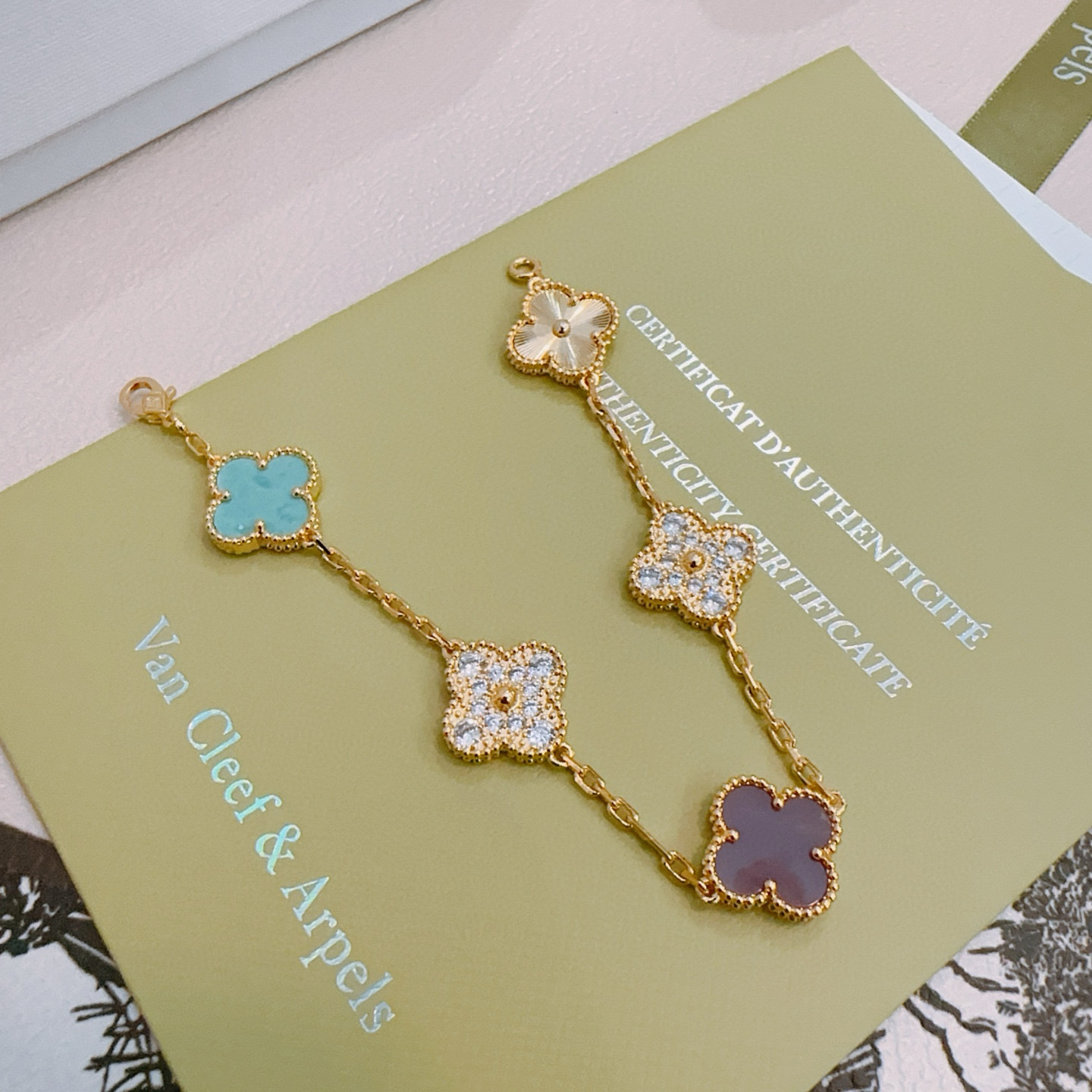 Van Cleef Arpels Alhambra bracelet Yellow gold metal with turquoise purple rhodonite clear diamond and guilloche gold four-leaf clover motifs 18cm