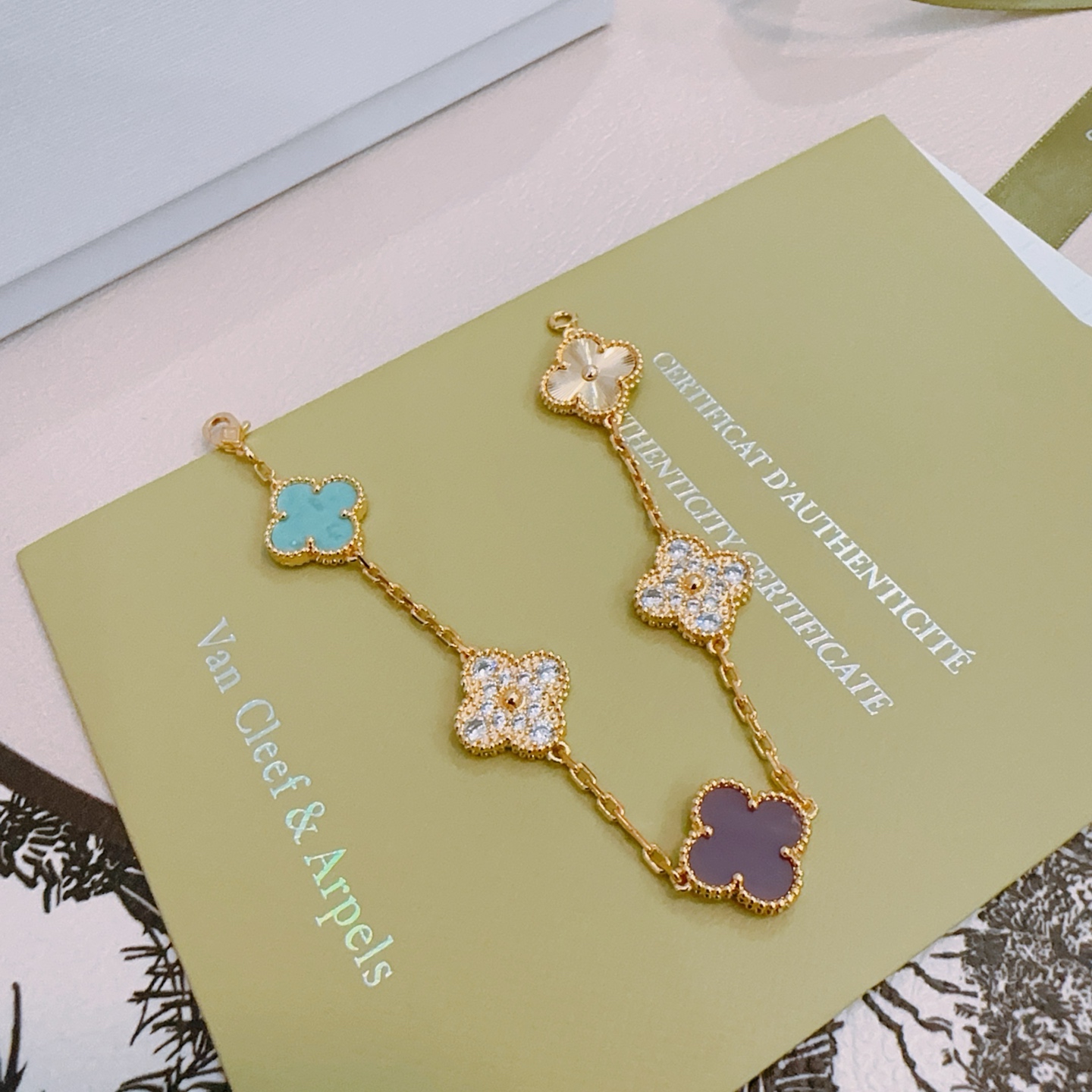 Van Cleef Arpels Alhambra bracelet Yellow gold metal with turquoise purple rhodonite clear diamond and guilloche gold four-leaf clover motifs 18cm