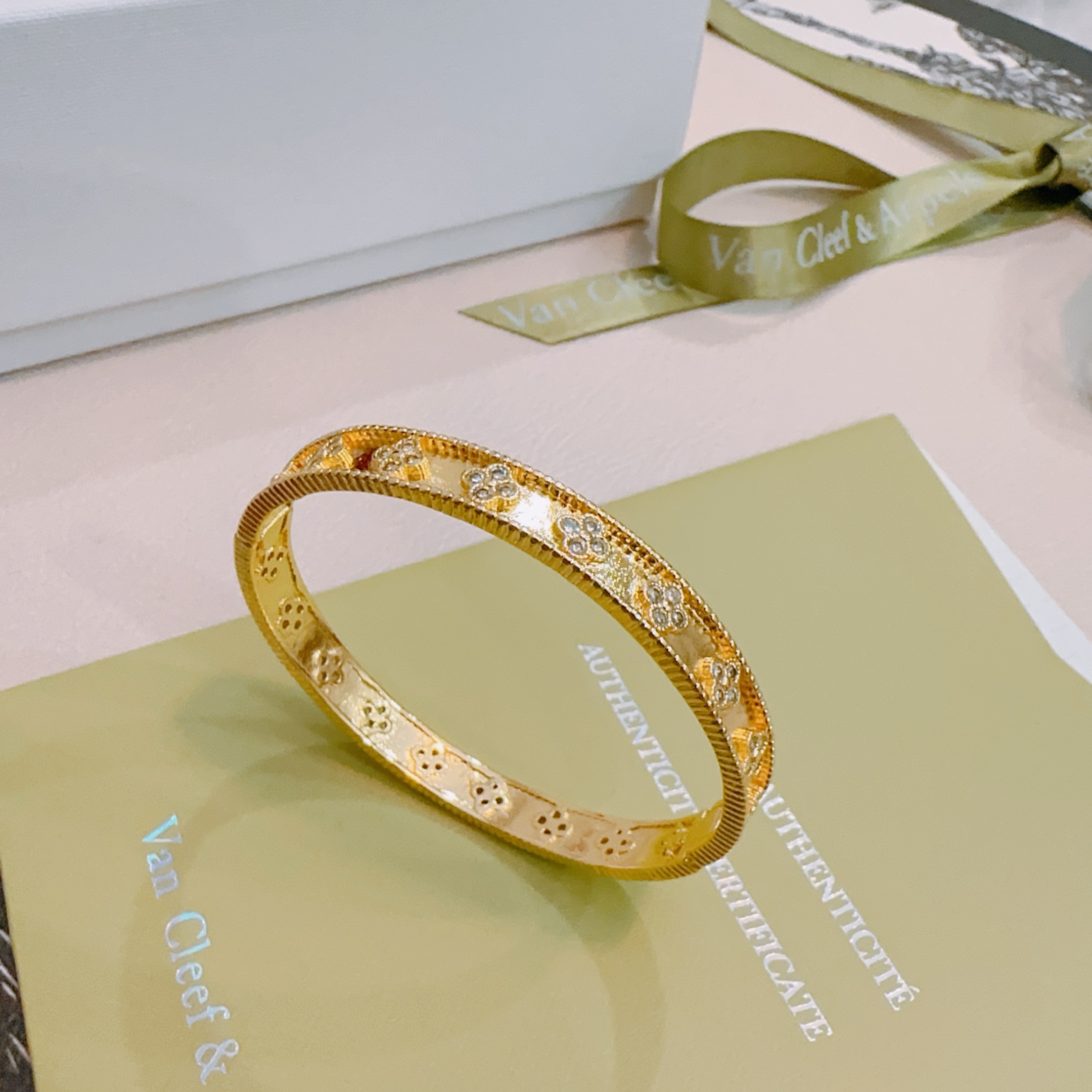 Van Cleef Arpels Perlee Clovers bracelet Yellow gold with clear diamond accents white gold with clear diamond accents 17cm inner circumference