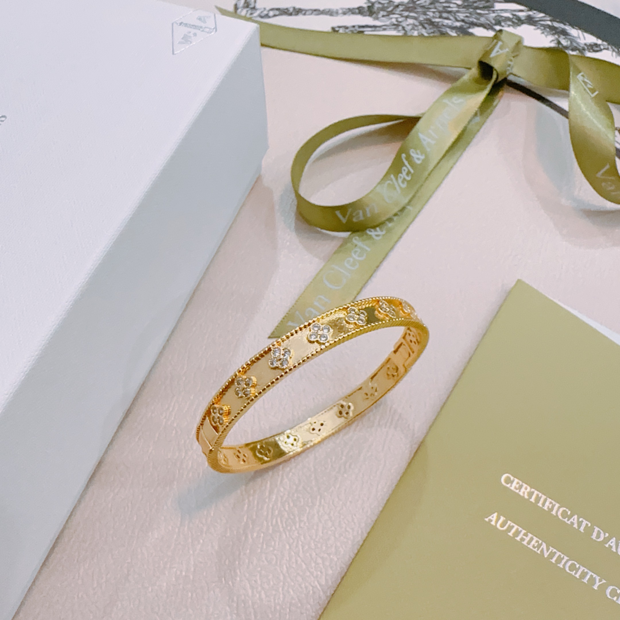 Van Cleef Arpels Perlee Clovers bracelet Yellow gold with clear diamond accents white gold with clear diamond accents 17cm inner circumference