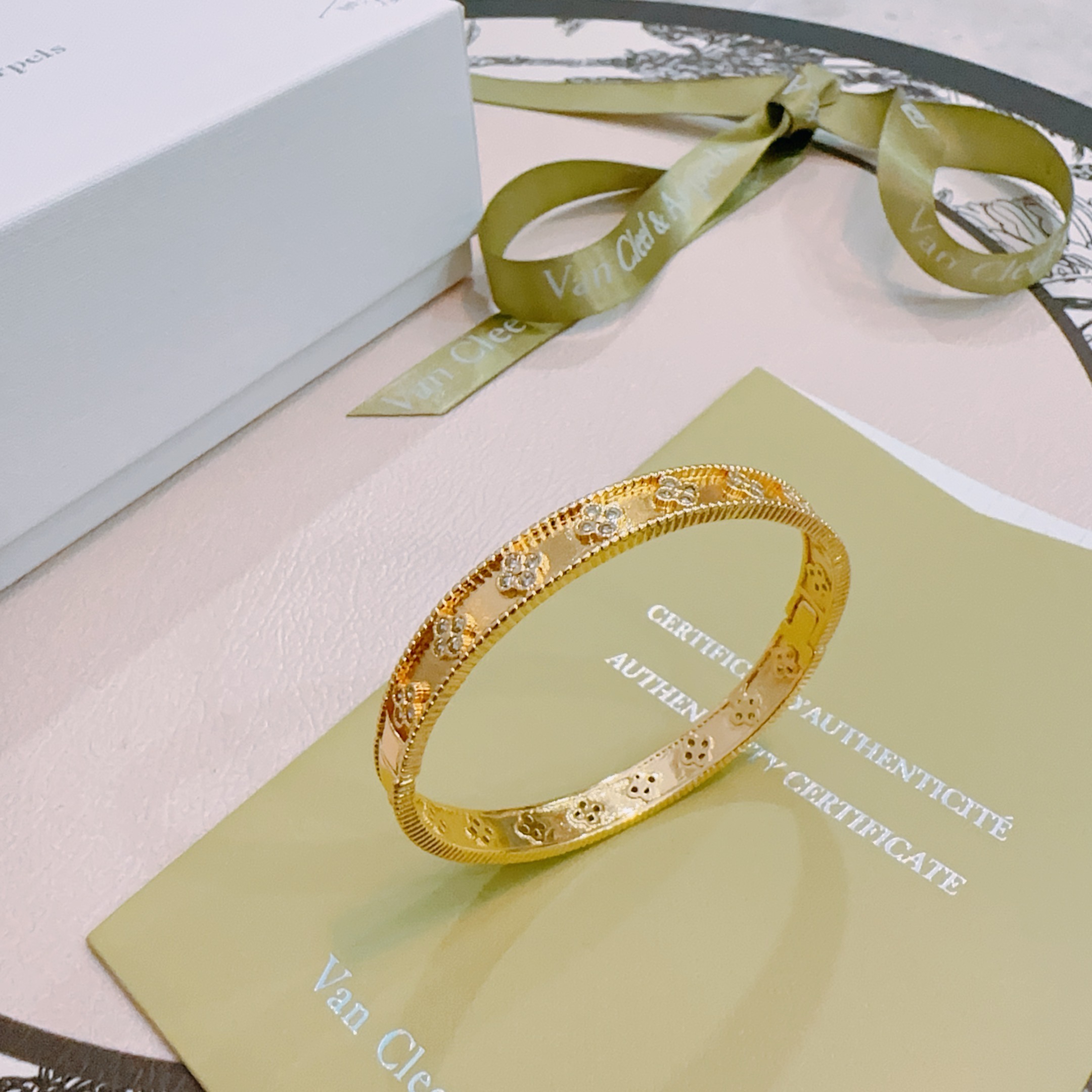 Van Cleef Arpels Perlee Clovers bracelet Yellow gold with clear diamond accents white gold with clear diamond accents 17cm inner circumference