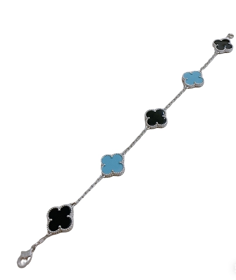 Van Cleef Arpels Alhambra bracelet Silver-toned metal with black onyx and turquoise blue clover inlays 18cm