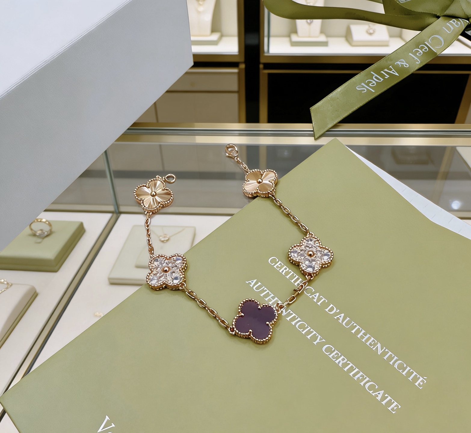 Van Cleef Arpels Alhambra bracelet Rose gold metal with clear diamond accents and dark purple stone clover motifs 19cm
