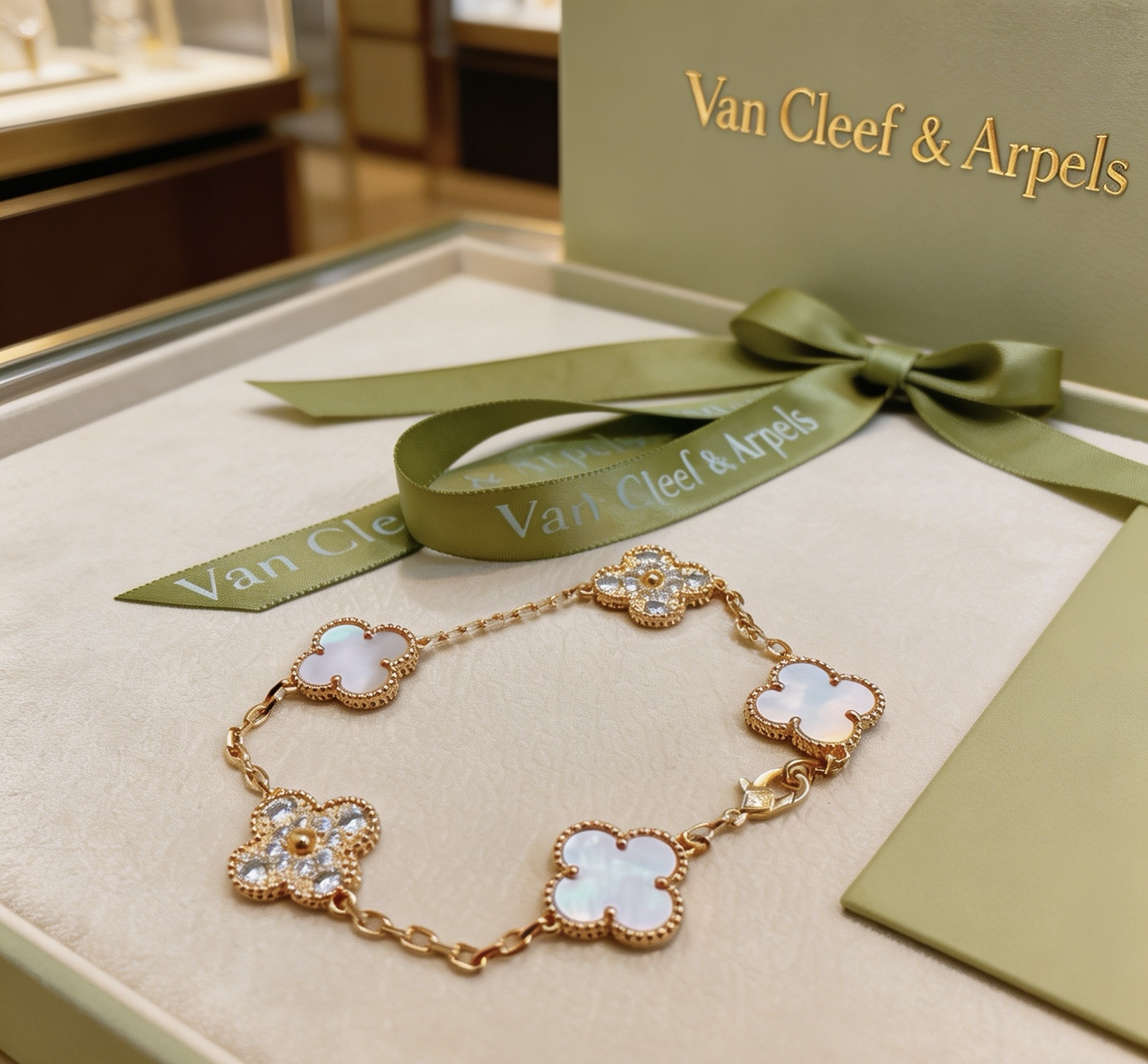 Van Cleef Arpels Alhambra bracelet Yellow gold metal with white mother-of-pearl and clear diamond accents 18cm