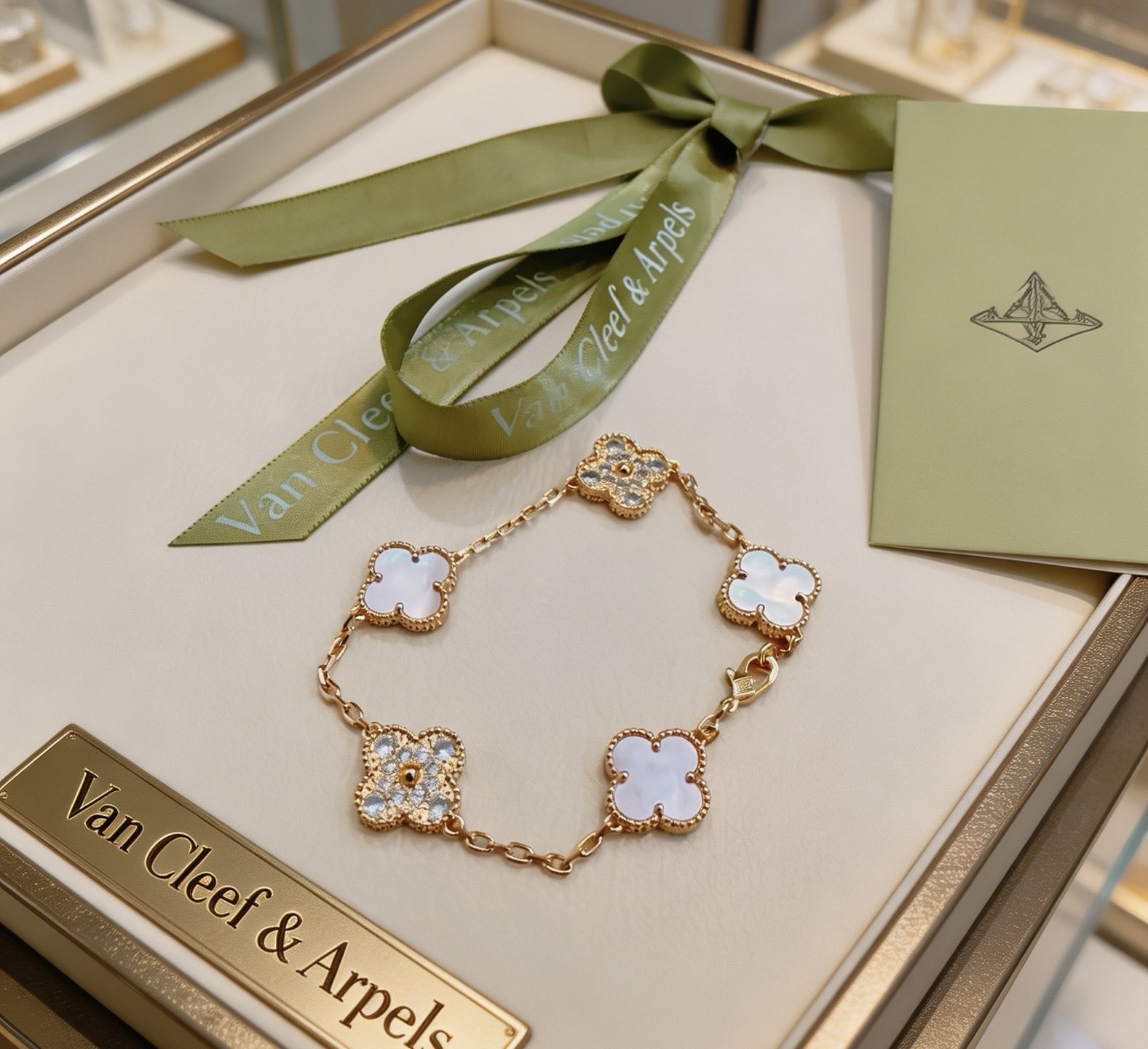 Van Cleef Arpels Alhambra bracelet Yellow gold metal with white mother-of-pearl and clear diamond accents 18cm
