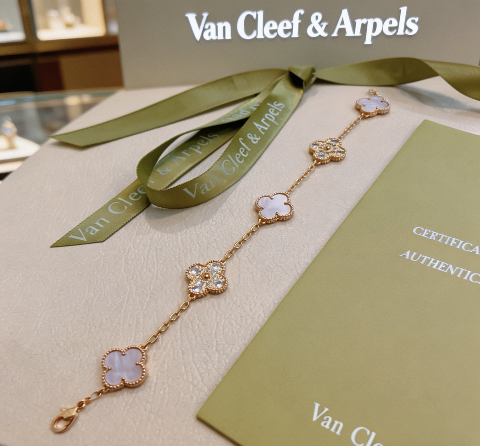 Van Cleef Arpels Alhambra bracelet Yellow gold metal with white mother-of-pearl and clear diamond accents 18cm