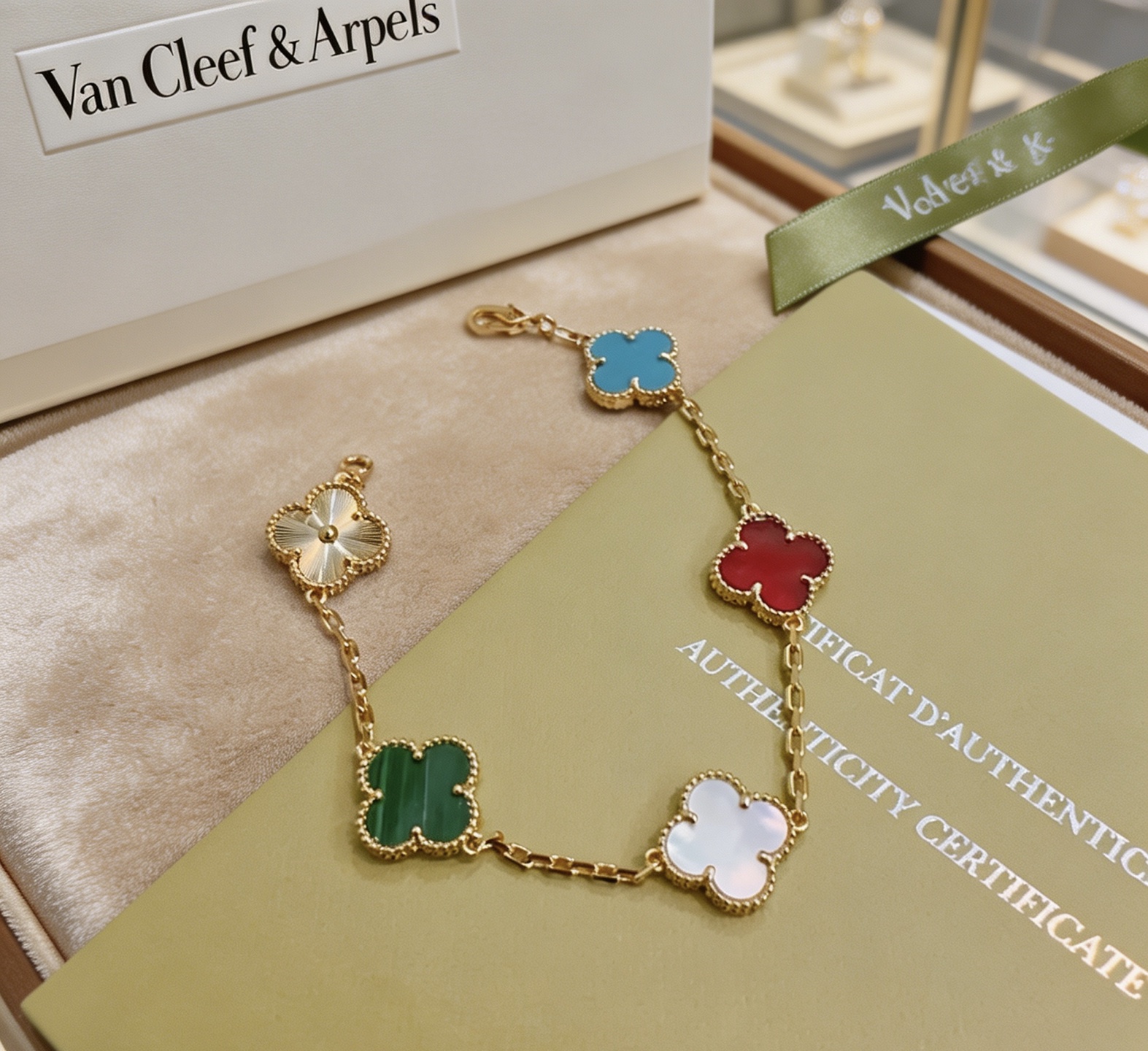 Van Cleef Arpels Alhambra bracelet Yellow gold metal with blue turquoise red carnelian white mother-of-pearl green malachite and gold guilloche clover motifs 17cm