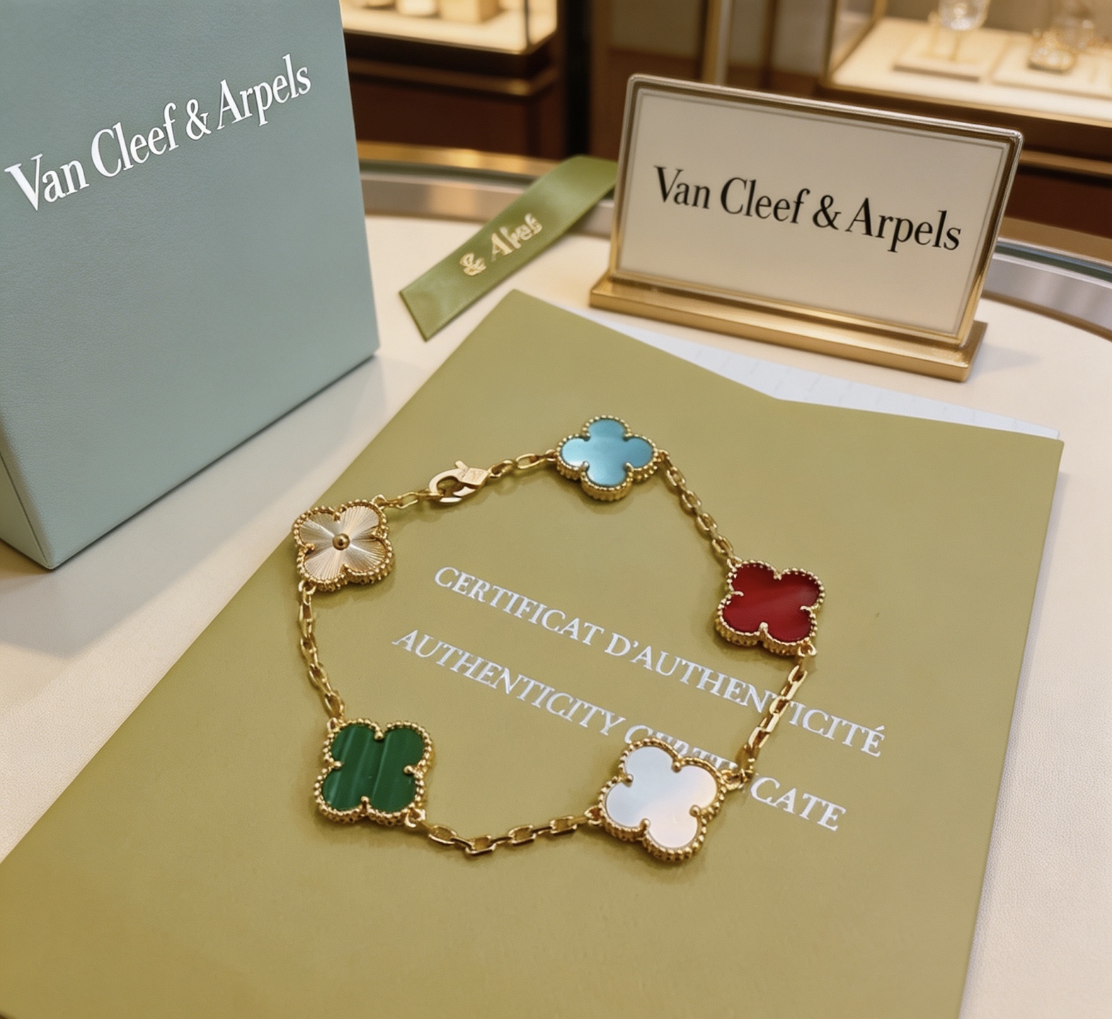 Van Cleef Arpels Alhambra bracelet Yellow gold metal with blue turquoise red carnelian white mother-of-pearl green malachite and gold guilloche clover motifs 17cm
