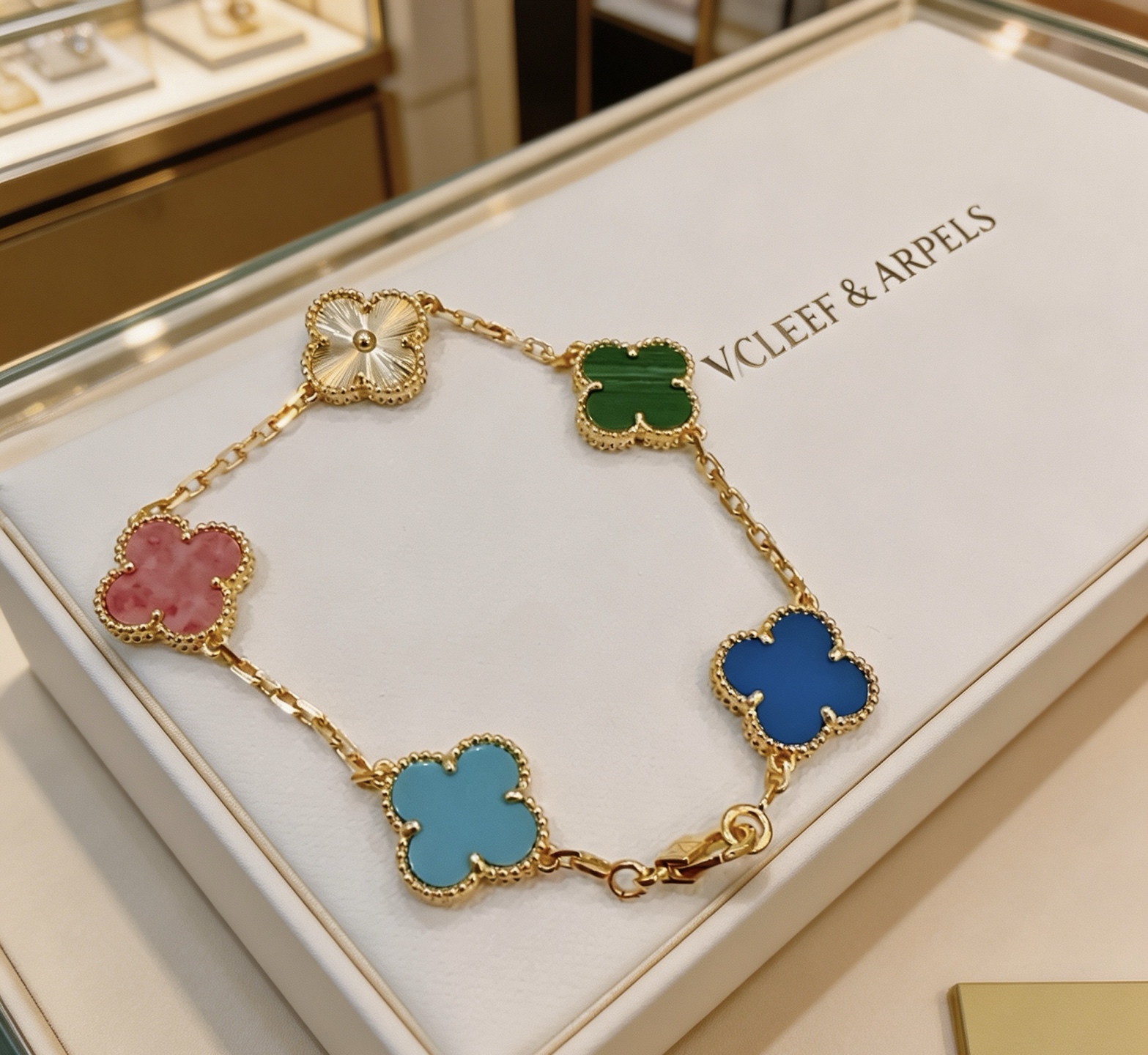 Van Cleef Arpels Alhambra bracelet Yellow gold metal with multicolor clover motifs white guilloche green malachite pink rhodonite blue agate light blue turquoise 18cm