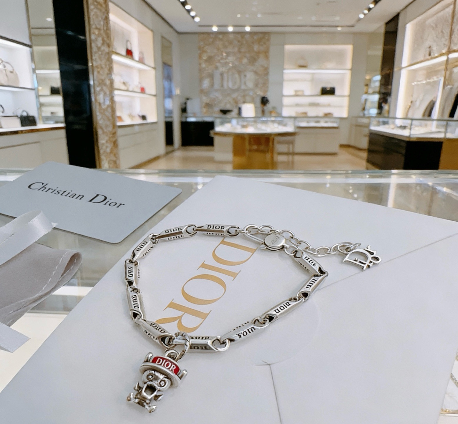 Dior DIOR x Otani Workshop Robot Charm Chain Bracelet bracelet silver-toned metal with red enamel accent 18cm with 3cm extender