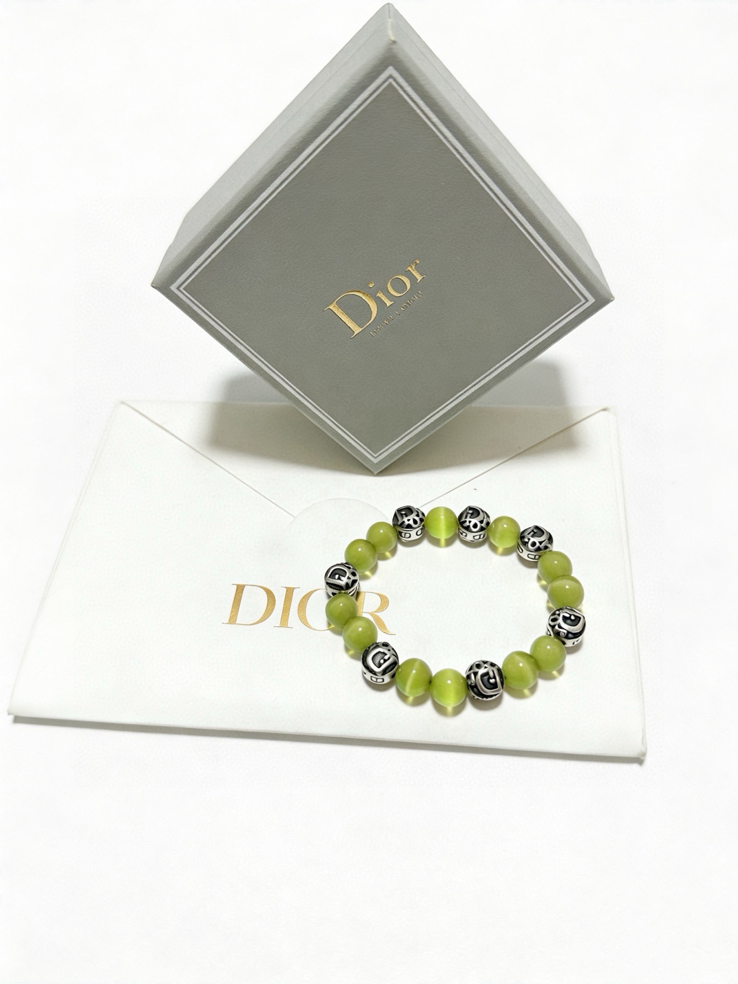 Dior Dior Oblique Logo Beaded Bracelet bracelet Antique silver-tone metal with black enamel accents light lime green cat s eye beads 19cm