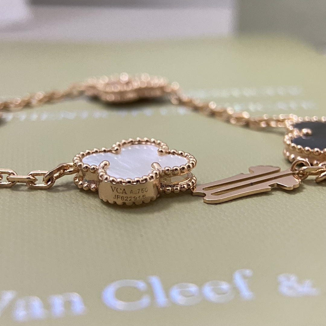 Van Cleef Arpels Alhambra bracelet White gold with white mother-of-pearl chalcedony and guilloche white gold clover motifs 19cm