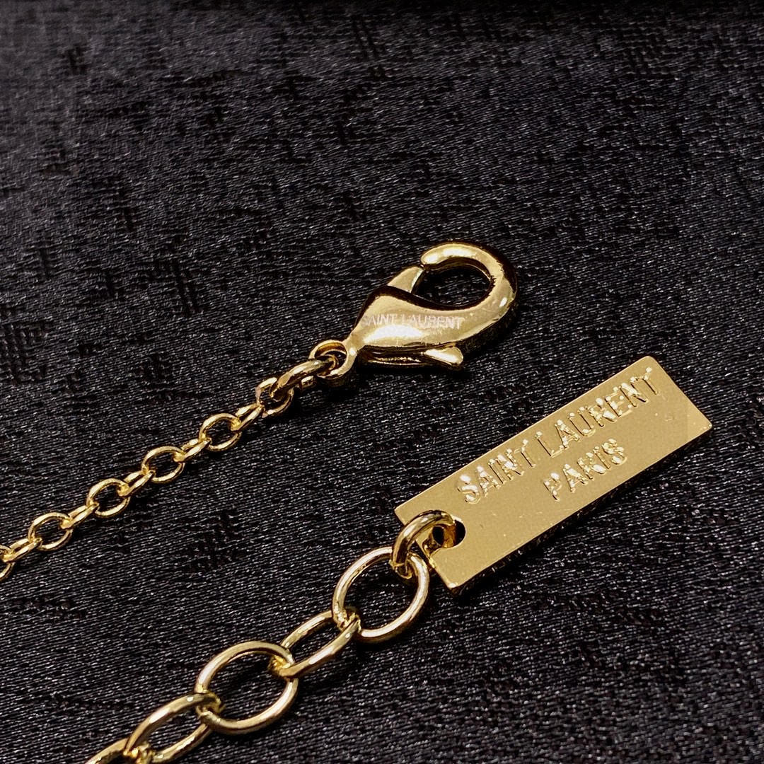 Saint Laurent Cassandre YSL Logo Pendant necklace gold-tone metal no accent stones 18 inch