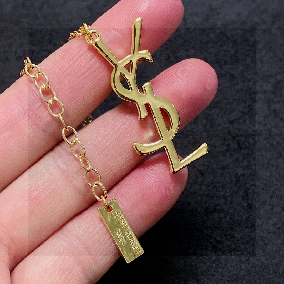 Saint Laurent Cassandre YSL Logo Pendant necklace gold-tone metal no accent stones 18 inch