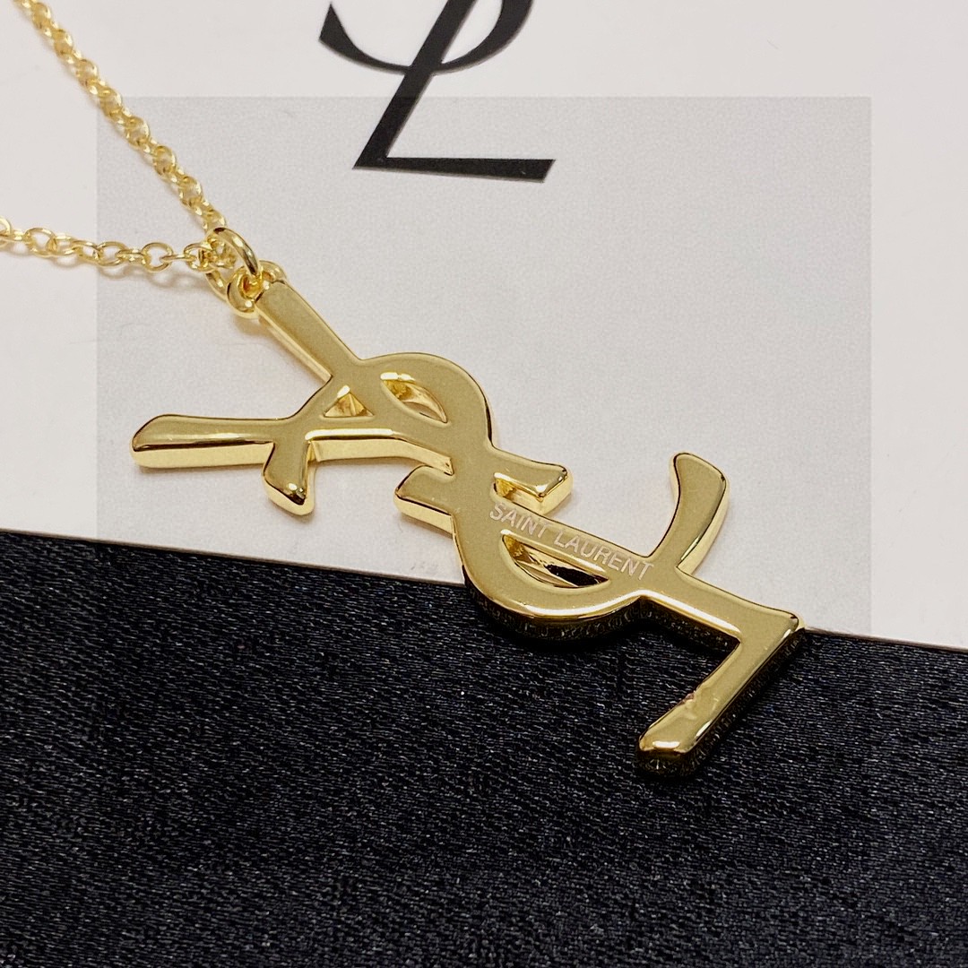 Saint Laurent Cassandre YSL Logo Pendant necklace gold-tone metal no accent stones 18 inch