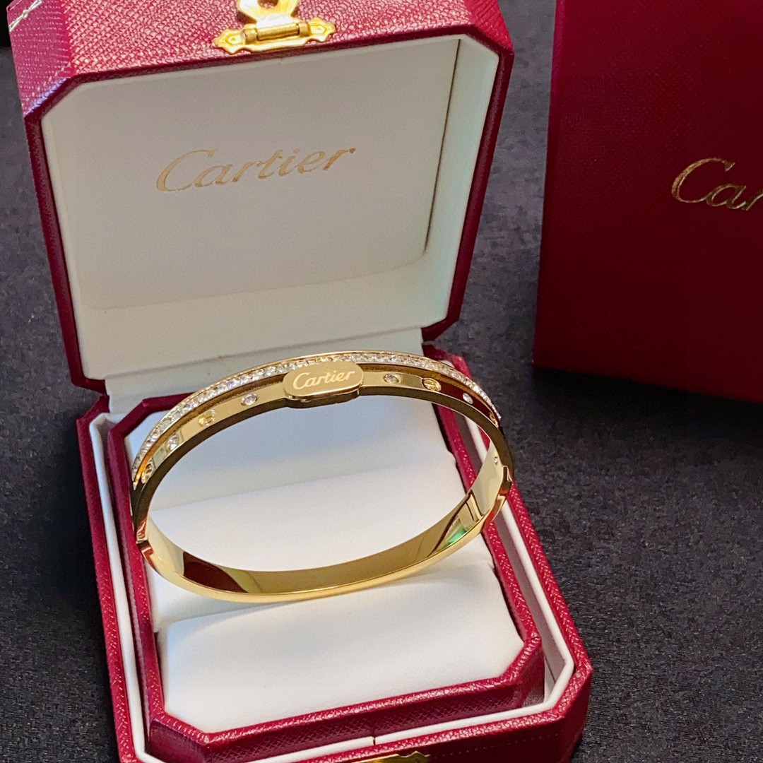 Cartier Love bracelet 18k yellow gold with clear diamond accents 17