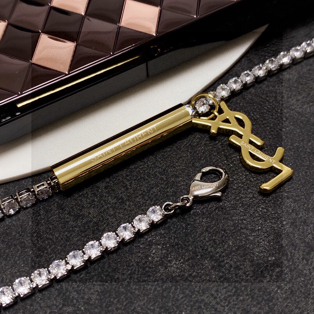 Saint Laurent Cassandre YSL Monogram Crystal Tennis Choker necklace Silver-toned metal with clear faceted crystals gold-toned metal logo and bar charm 40cm with 5cm extender chain