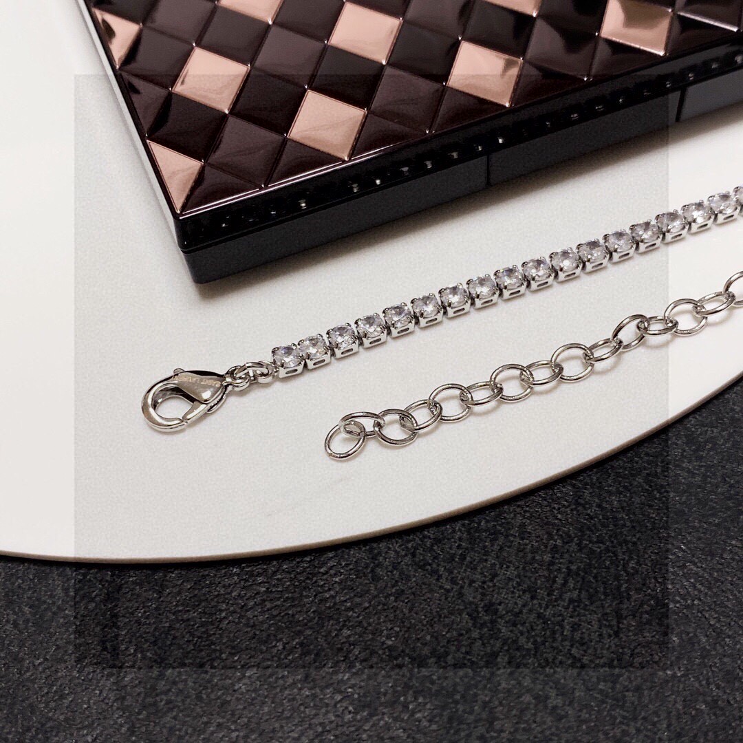 Saint Laurent Cassandre YSL Monogram Crystal Tennis Choker necklace Silver-toned metal with clear faceted crystals gold-toned metal logo and bar charm 40cm with 5cm extender chain