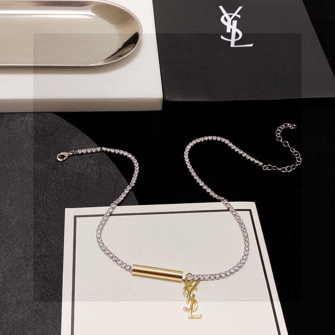 Saint Laurent Cassandre YSL Monogram Crystal Tennis Choker necklace Silver-toned metal with clear faceted crystals gold-toned metal logo and bar charm 40cm with 5cm extender chain