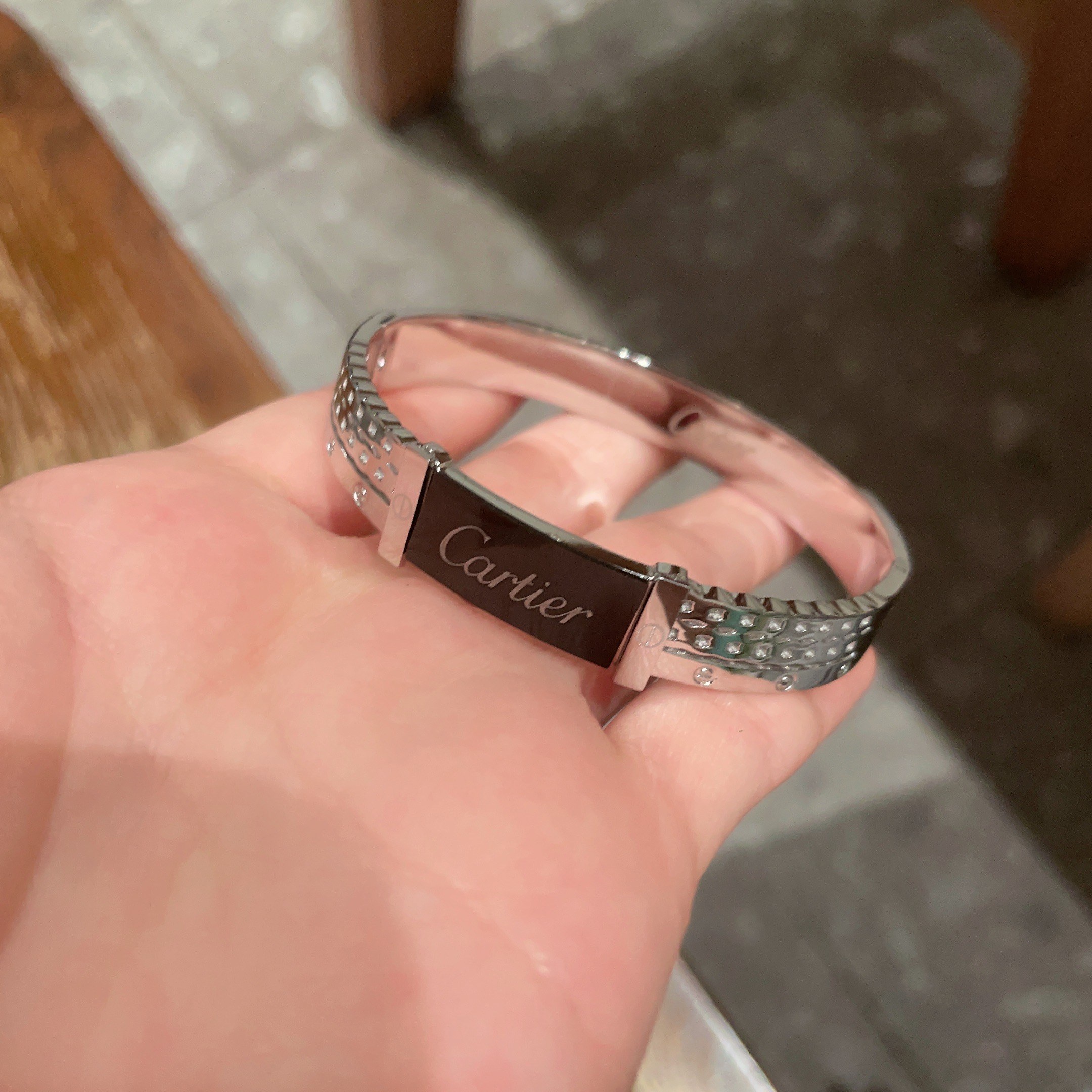 Cartier Logo Studded Bangle bracelet Silver-toned metal with black enamel logo plate 17cm