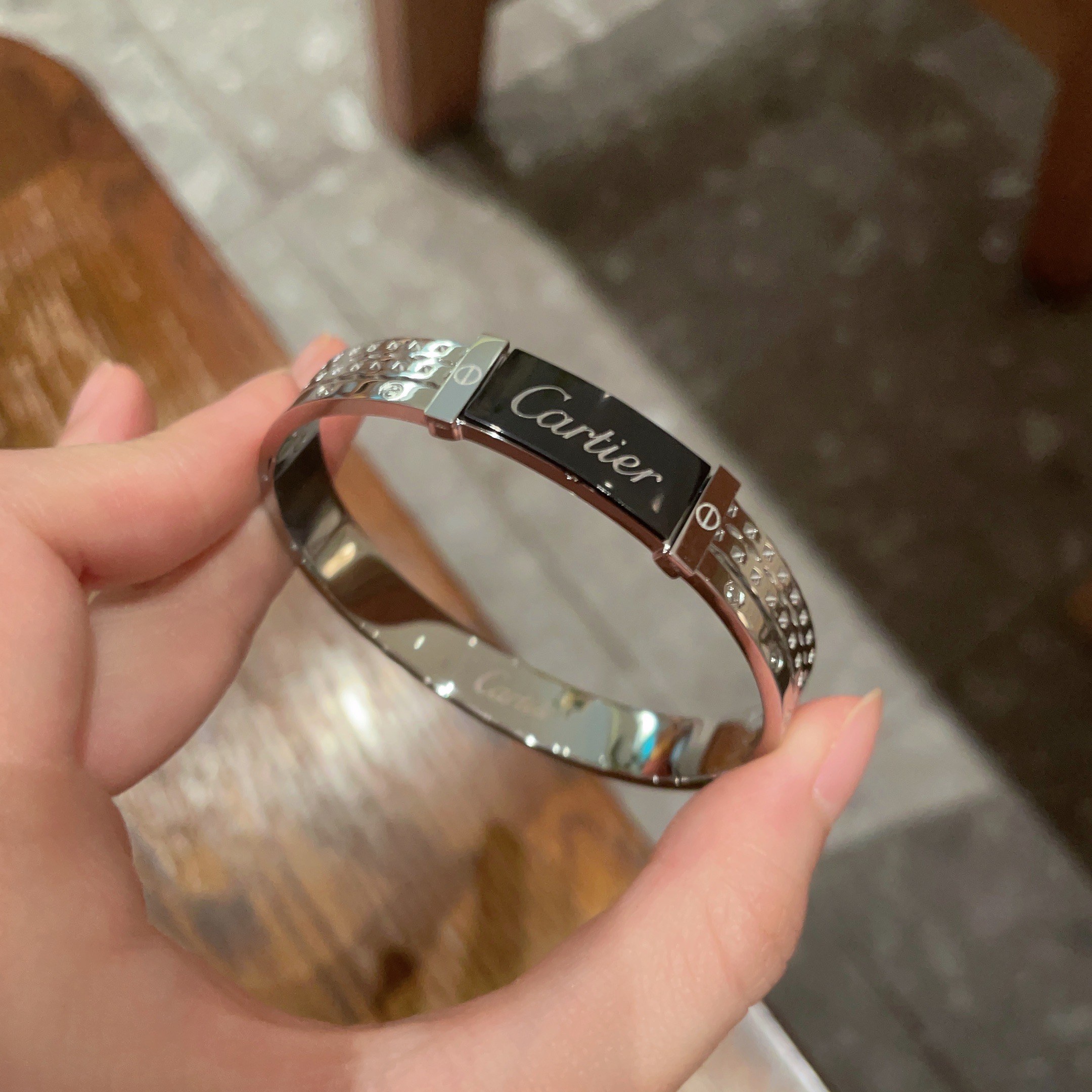 Cartier Logo Studded Bangle bracelet Silver-toned metal with black enamel logo plate 17cm