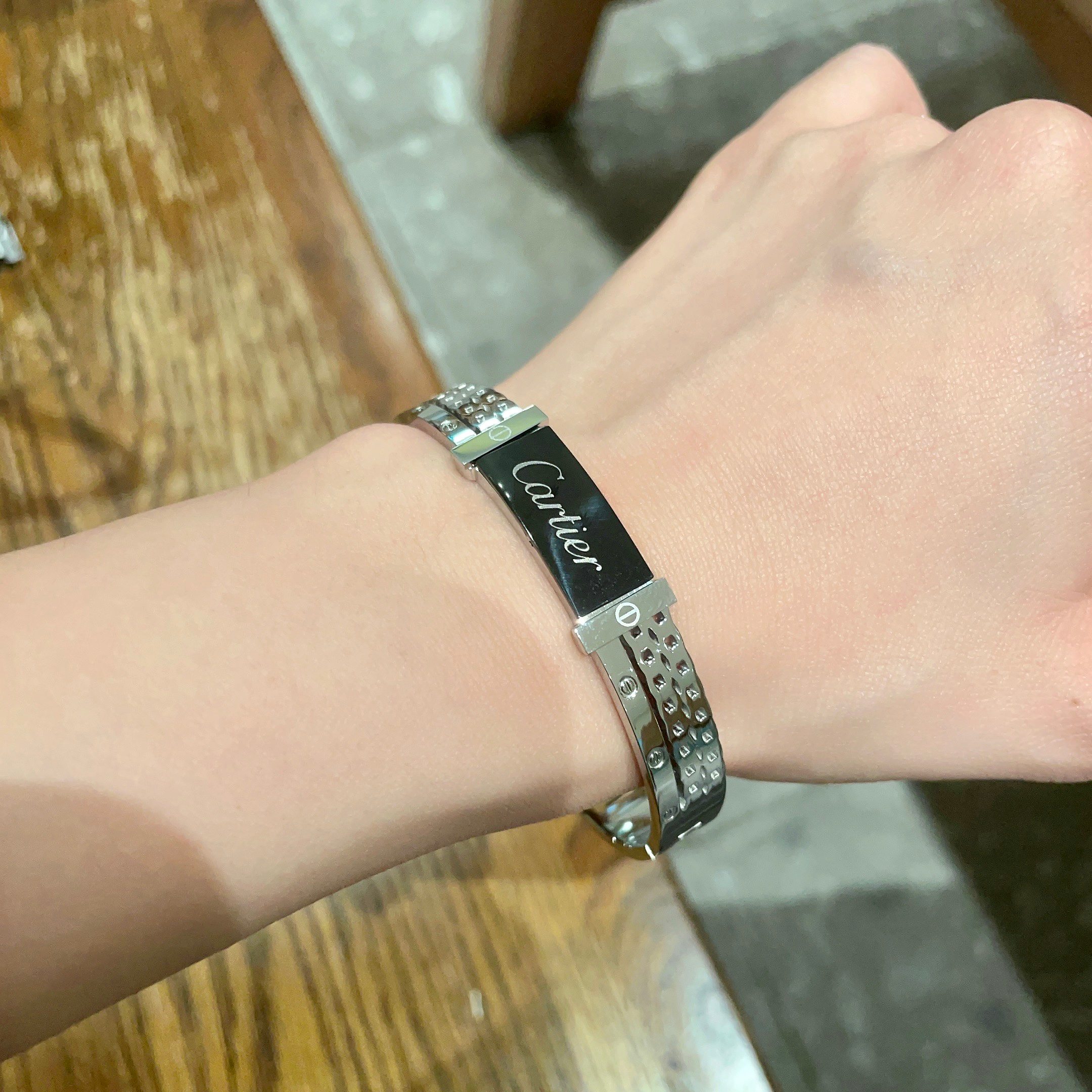 Cartier Logo Studded Bangle bracelet Silver-toned metal with black enamel logo plate 17cm