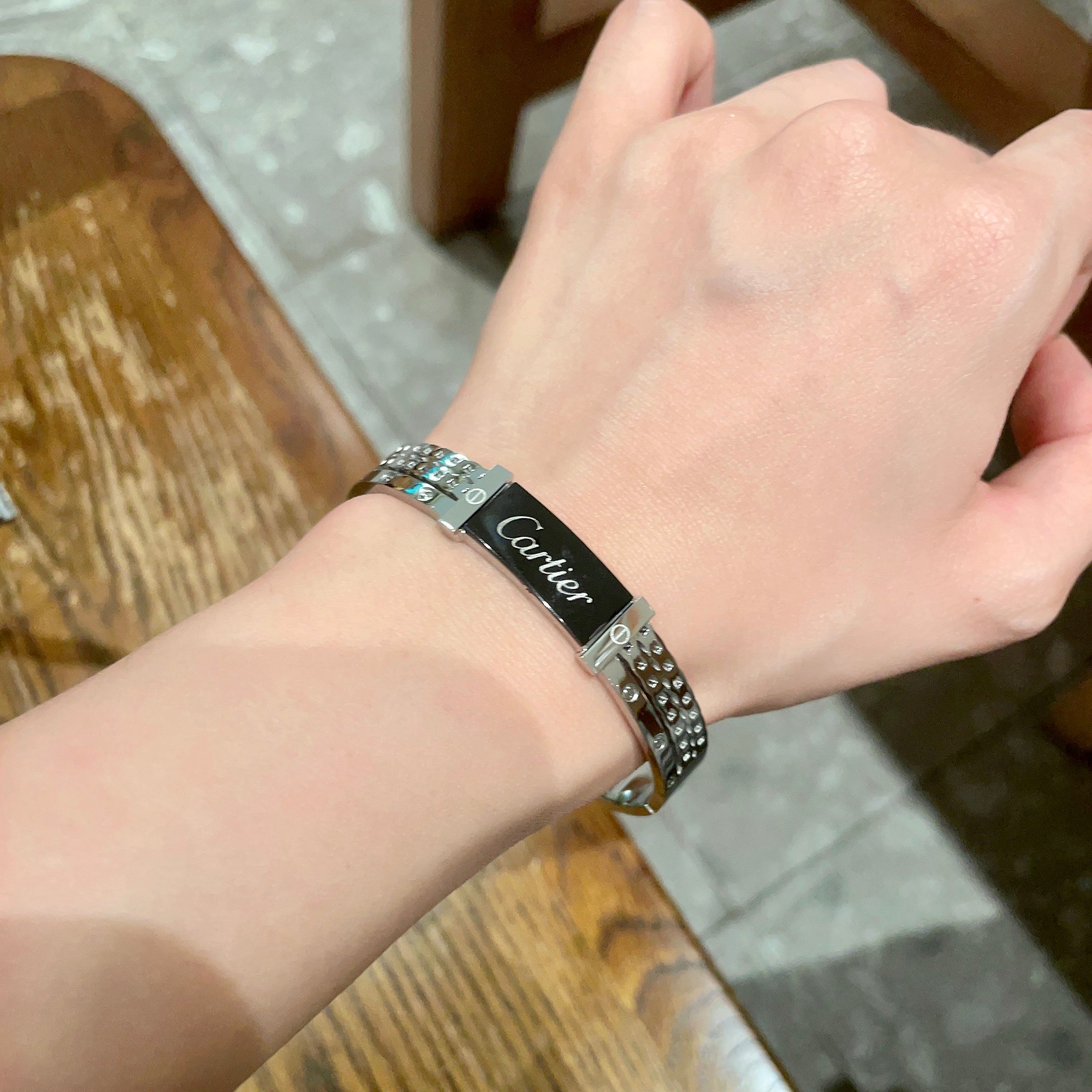 Cartier Logo Studded Bangle bracelet Silver-toned metal with black enamel logo plate 17cm