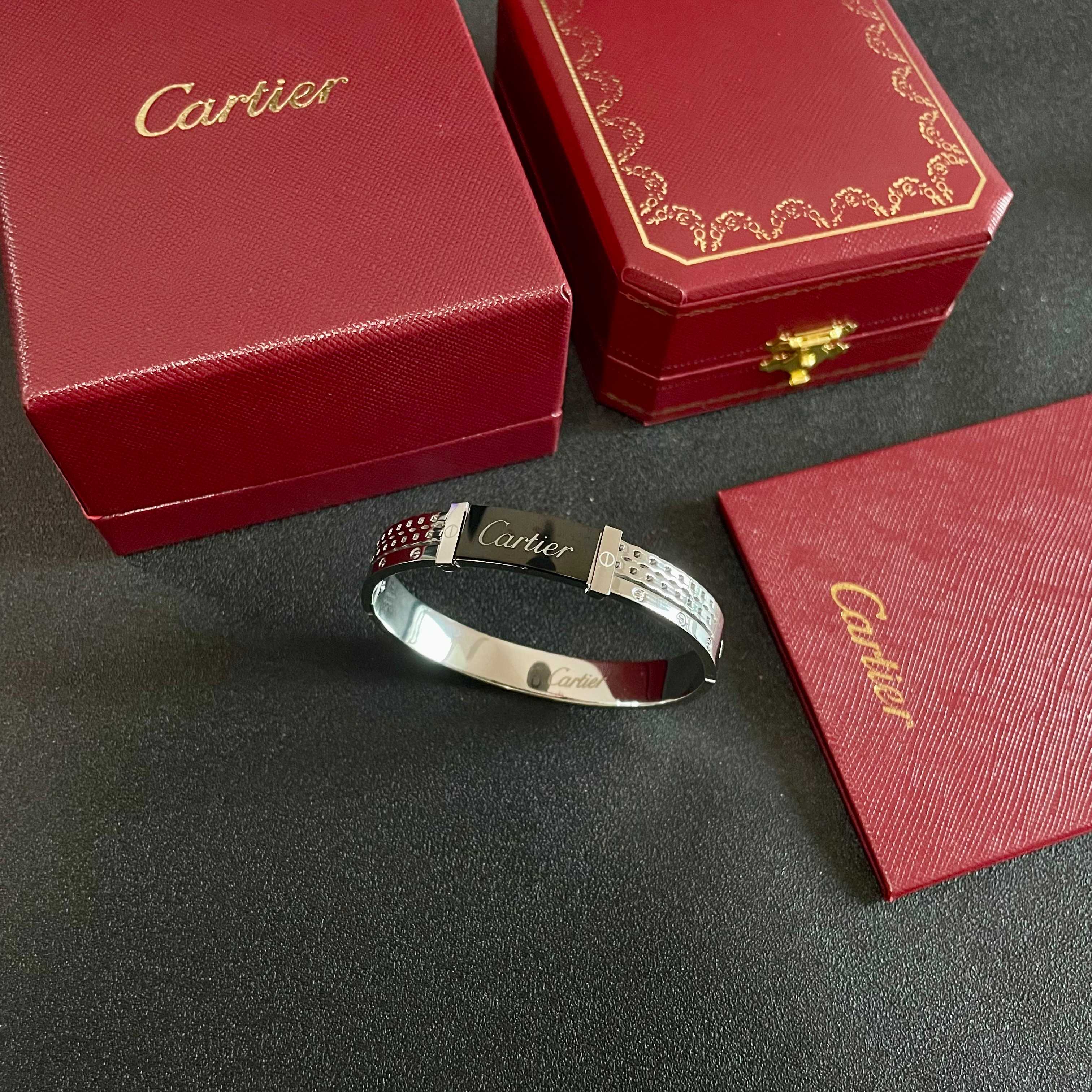 Cartier Logo Studded Bangle bracelet Silver-toned metal with black enamel logo plate 17cm