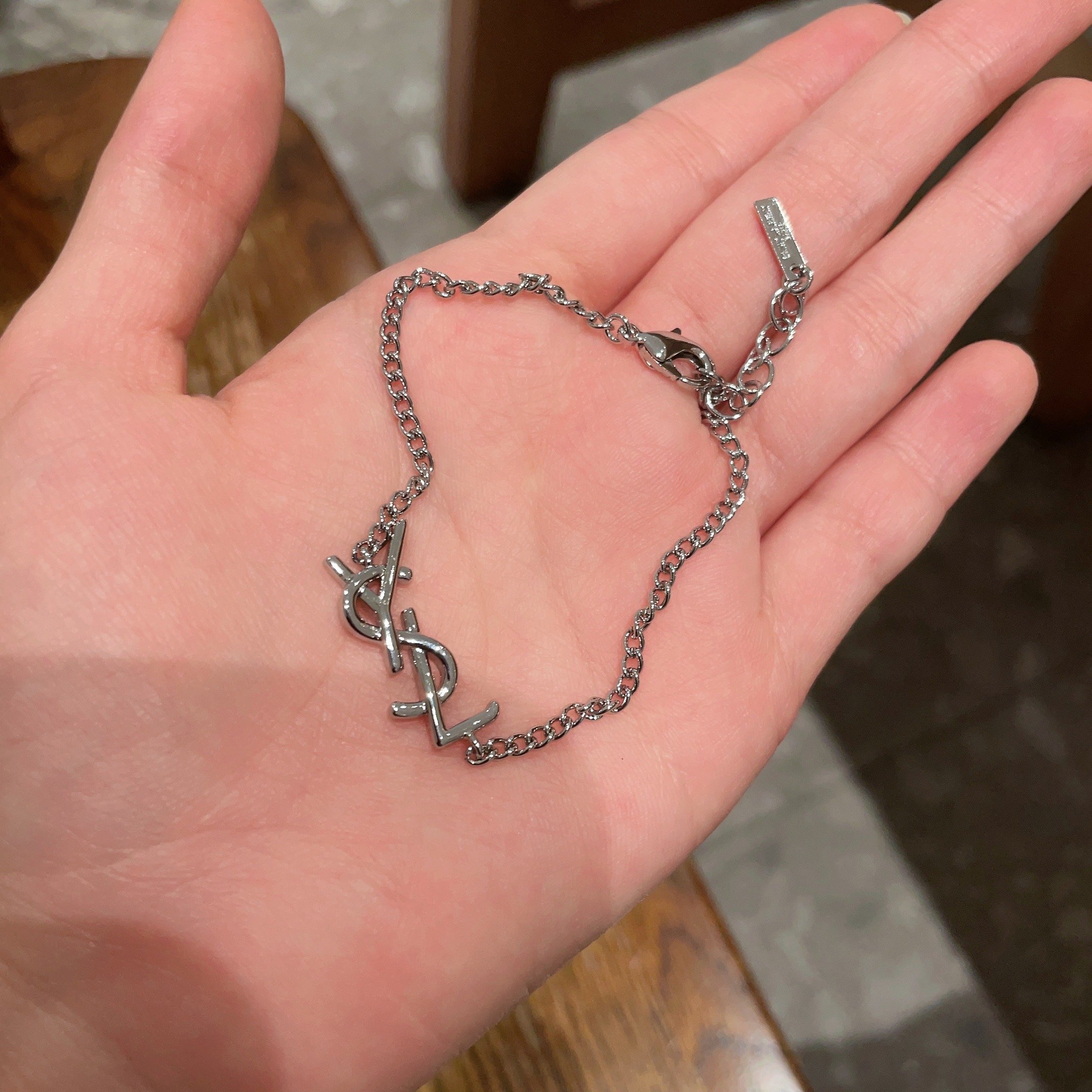 Saint Laurent Cassandre YSL Monogram bracelet silver-toned metal no gemstones 18cm with 3cm extender