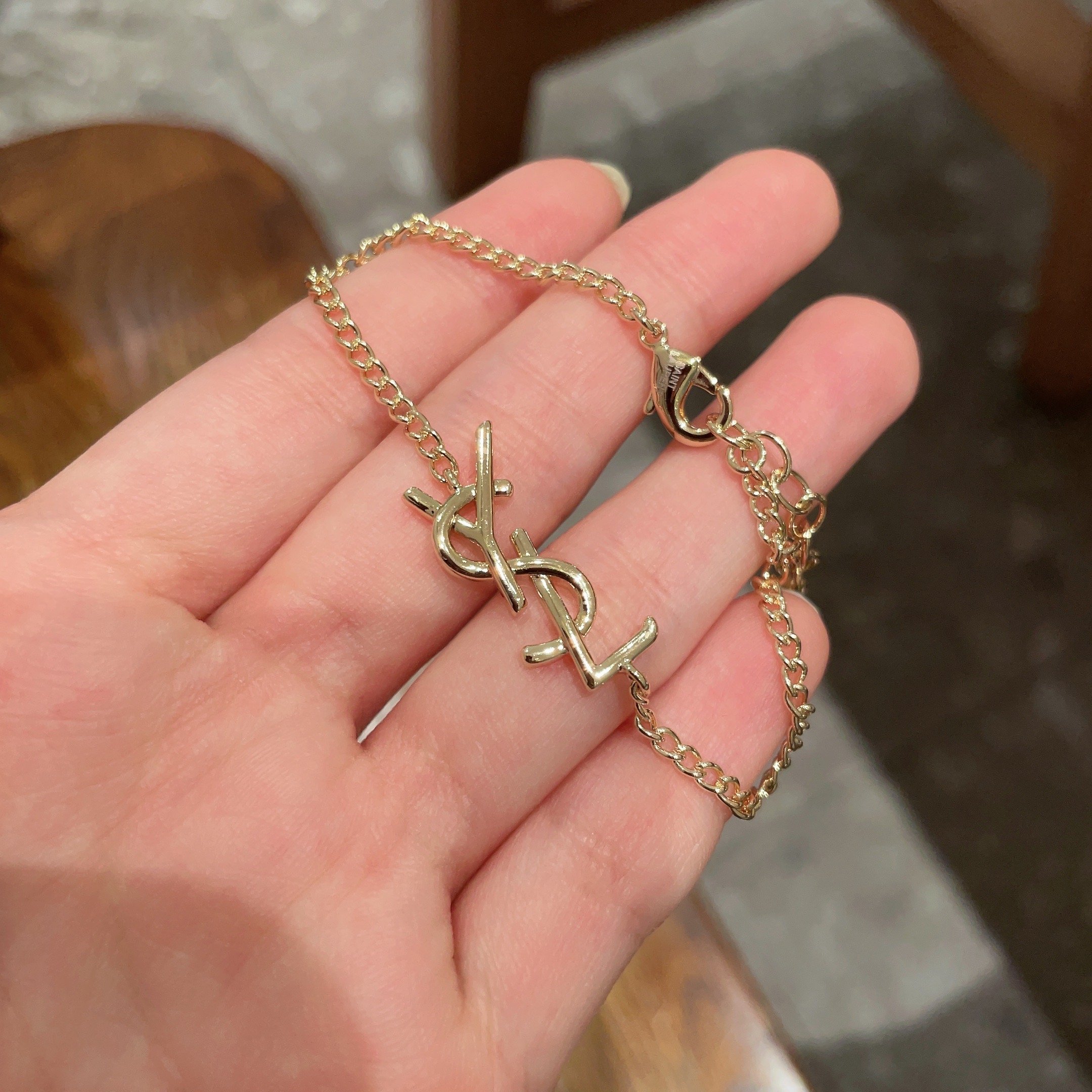 Saint Laurent Cassandre Monogram bracelet gold-tone metal 19cm adjustable