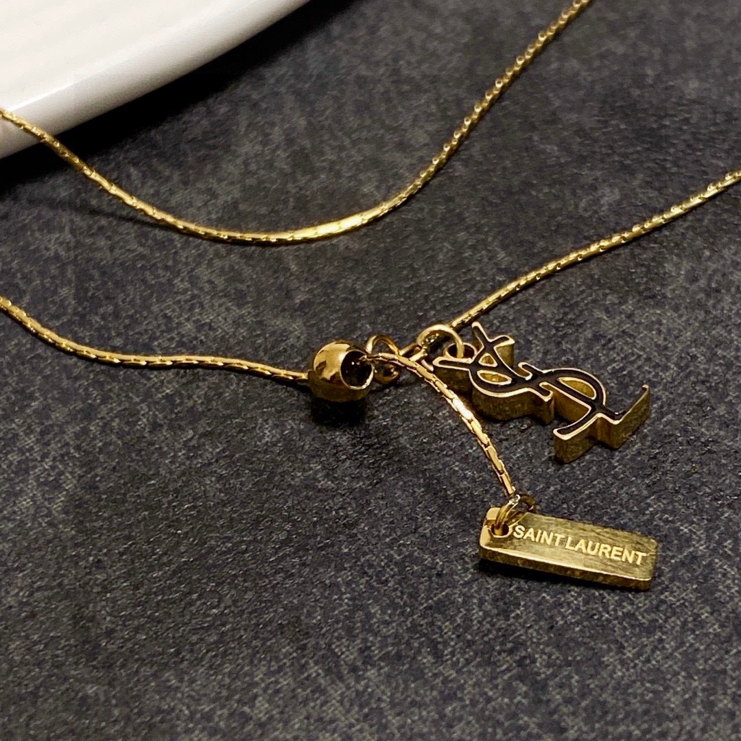Saint Laurent Cassandre YSL Logo Lariat necklace gold-tone metal 45cm with 5cm extender