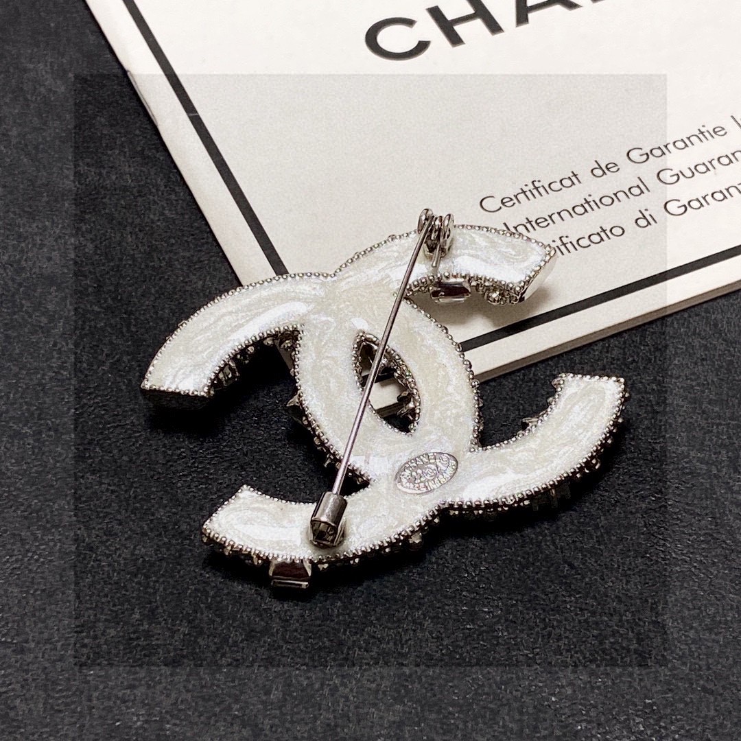 Chanel CC Logo Brooch brooch silver tone metal with clear crystals and white faux pearls 4 5cm width