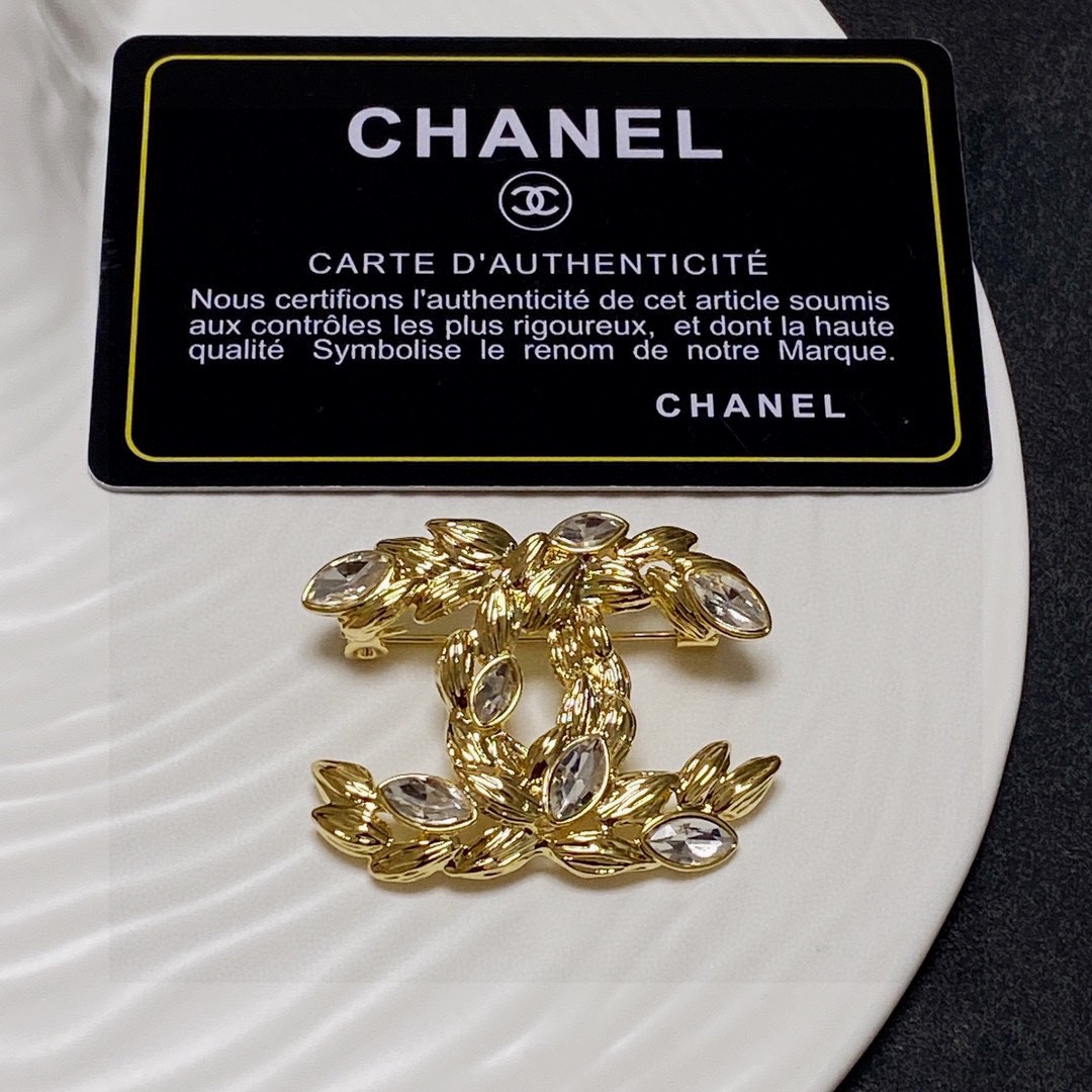 Chanel CC Wheat Leaf Crystal Brooch brooch Gold-tone metal with clear faceted marquise-cut crystals Approximately 4 5cm x 3