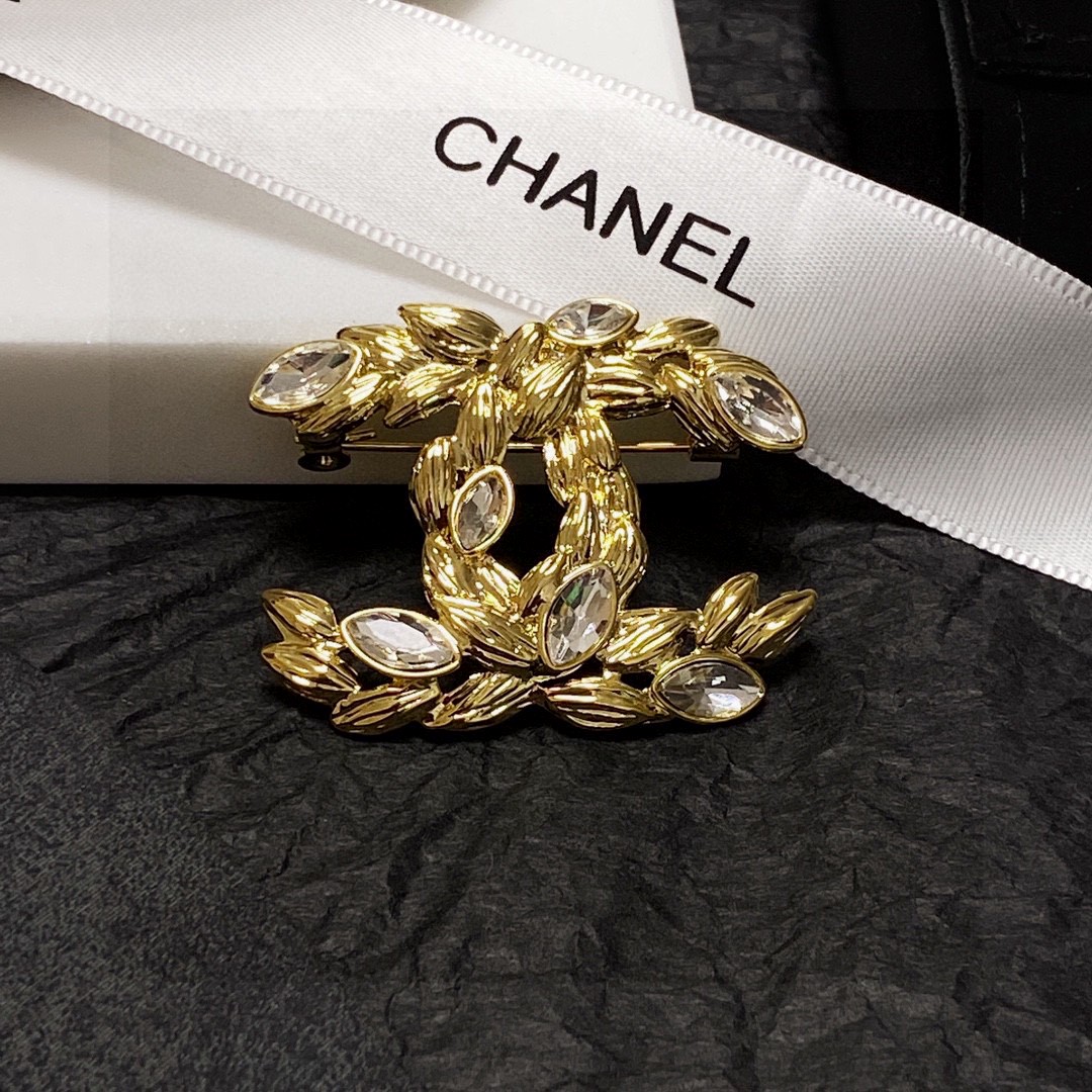 Chanel CC Wheat Leaf Crystal Brooch brooch Gold-tone metal with clear faceted marquise-cut crystals Approximately 4 5cm x 3