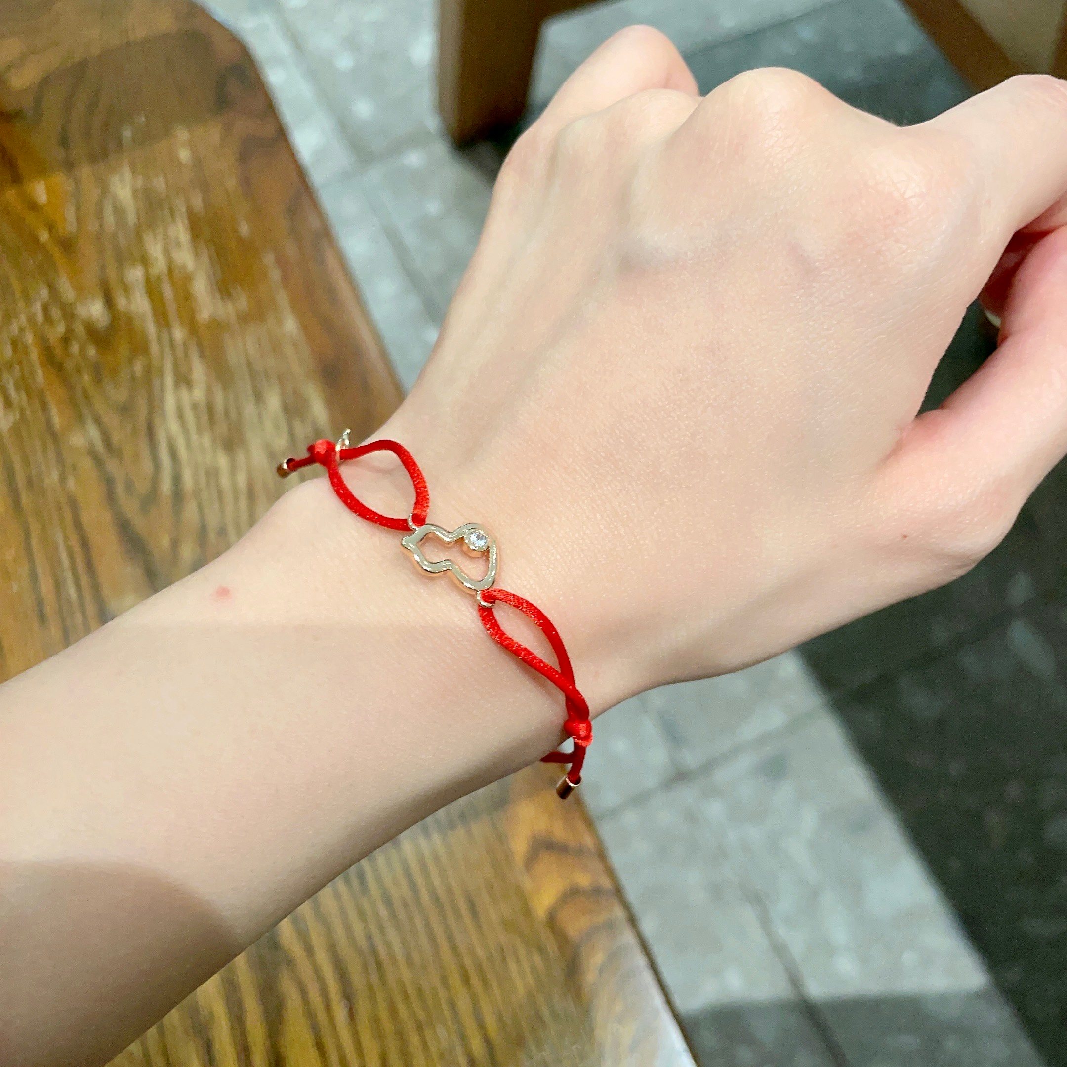 Qeelin Kirin Mini Gourd bracelet gold-toned metal clear diamond accent red cord adjustable sliding knot fits 15-19cm wrist