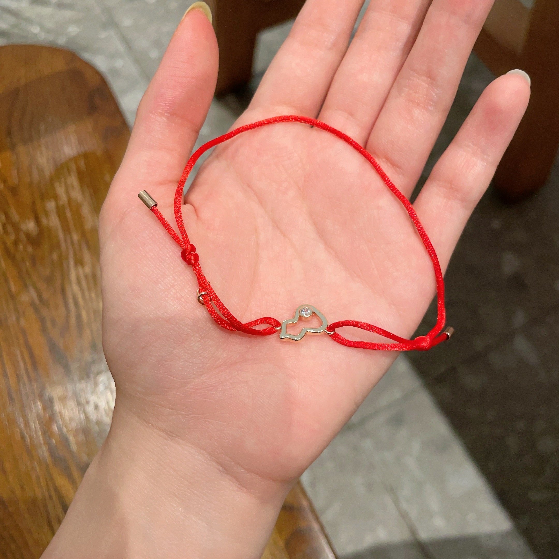 Qeelin Kirin Mini Gourd bracelet gold-toned metal clear diamond accent red cord adjustable sliding knot fits 15-19cm wrist