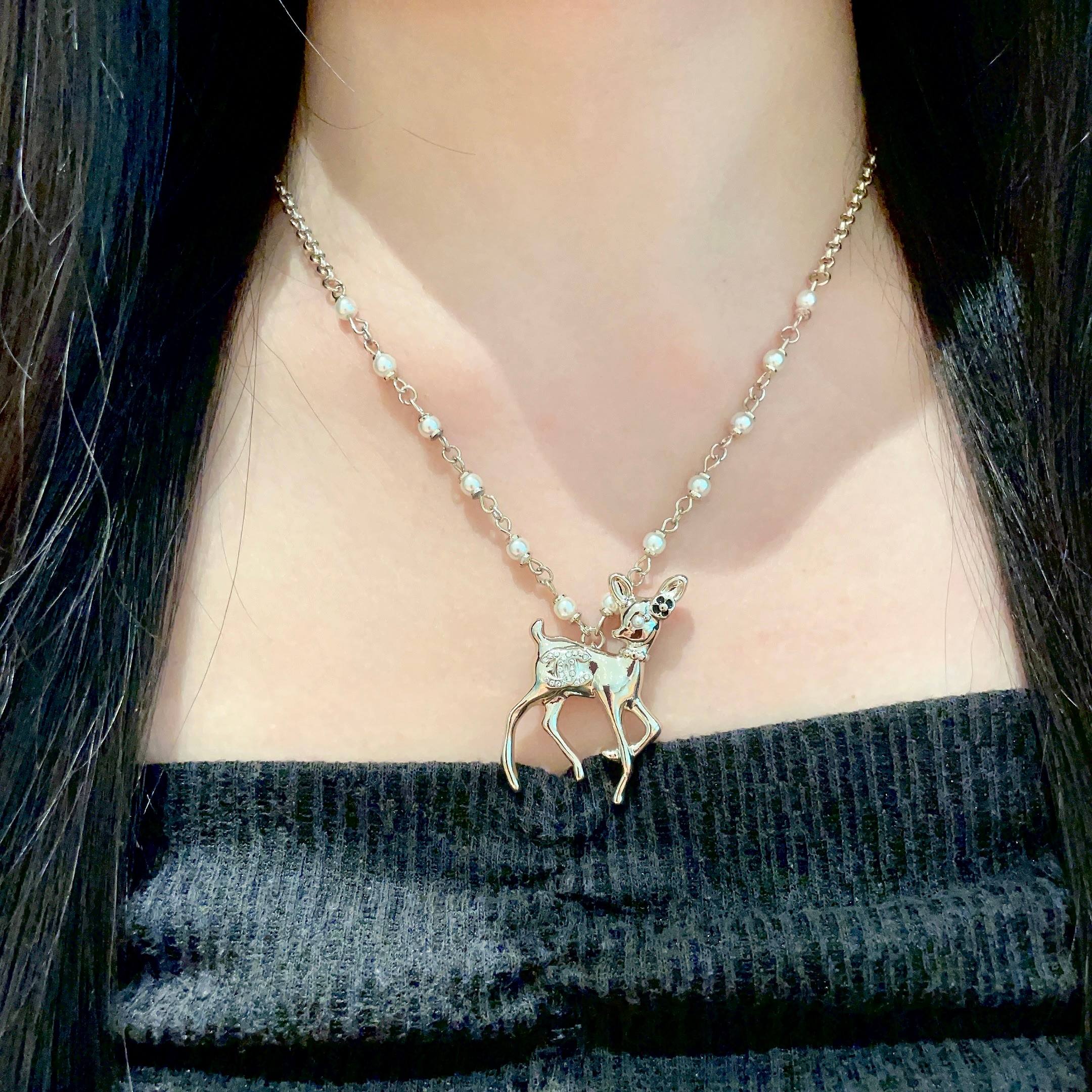Chanel CC Logo Bambi Deer Pearl Pendant necklace Light gold-tone metal white faux pearls clear crystals black enamel accents 42cm