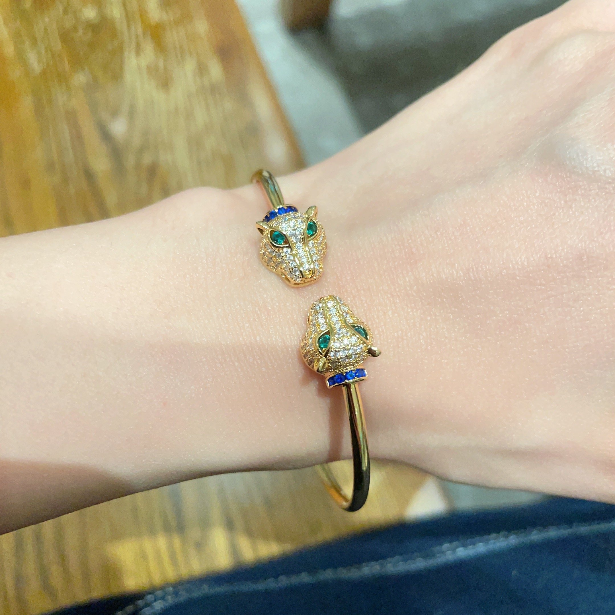 Cartier Panthere de Cartier bracelet 18k yellow gold pave clear diamonds emerald green eyes blue sapphire accents 17