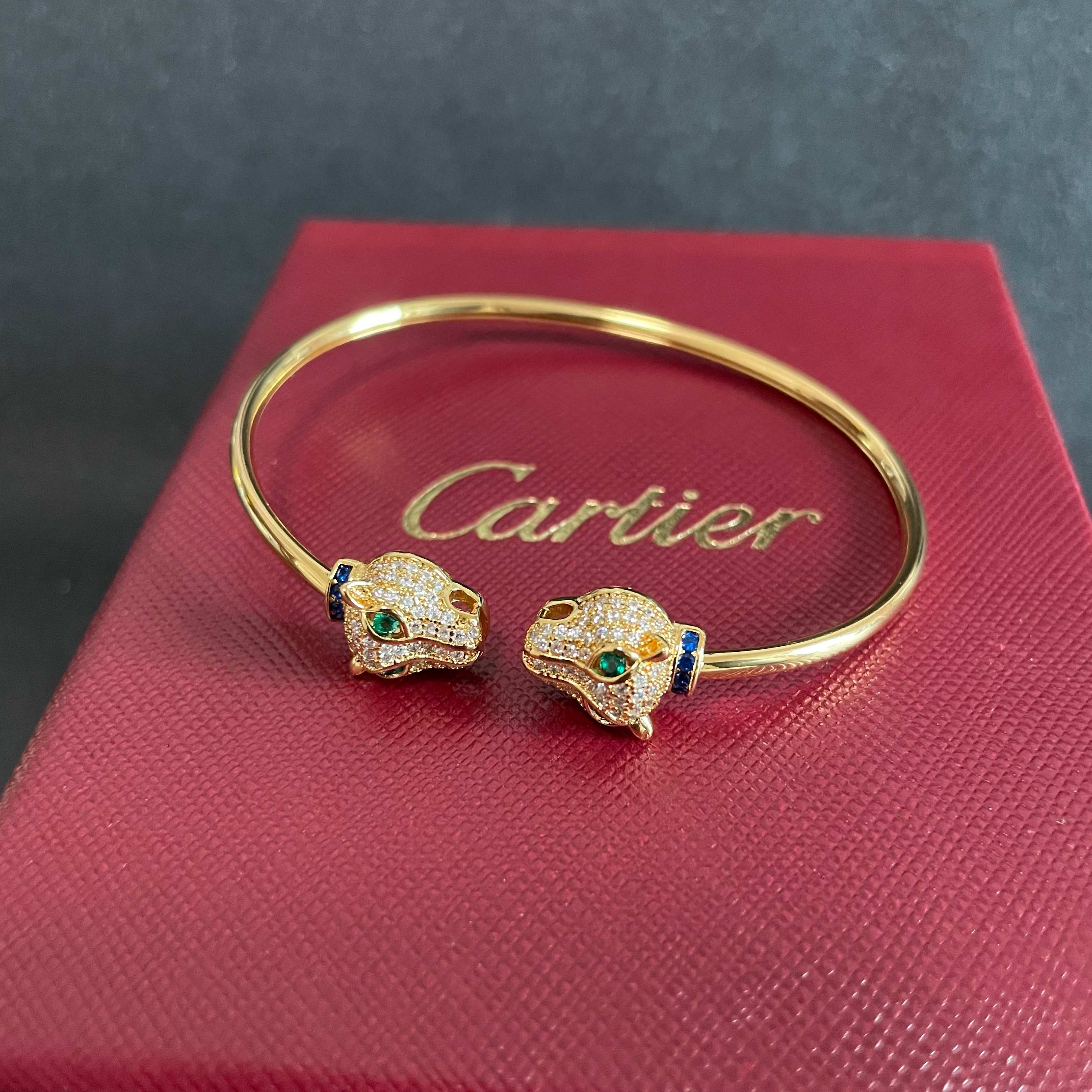 Cartier Panthere de Cartier bracelet 18k yellow gold pave clear diamonds emerald green eyes blue sapphire accents 17