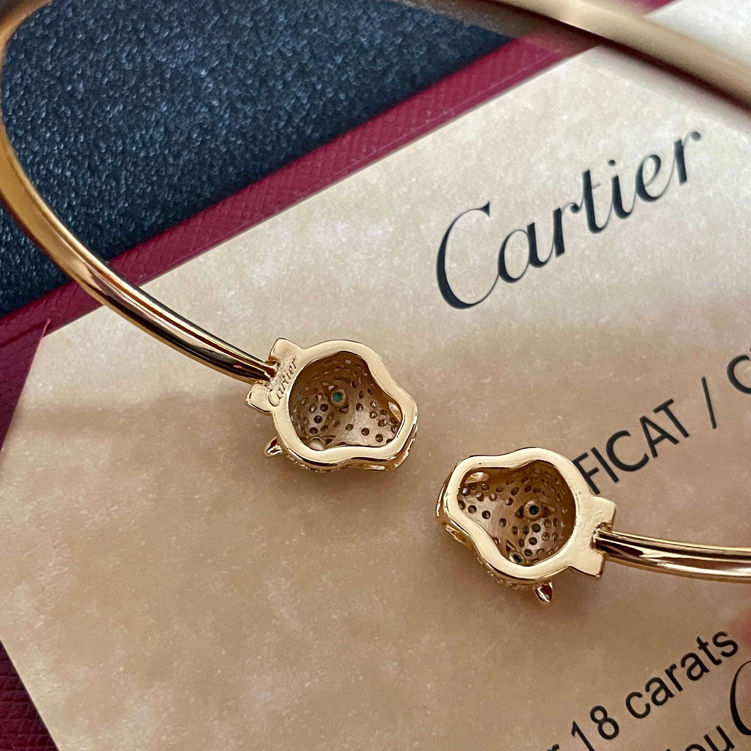 Cartier Panthere de Cartier bracelet 18k yellow gold pave clear diamonds emerald green eyes blue sapphire accents 17