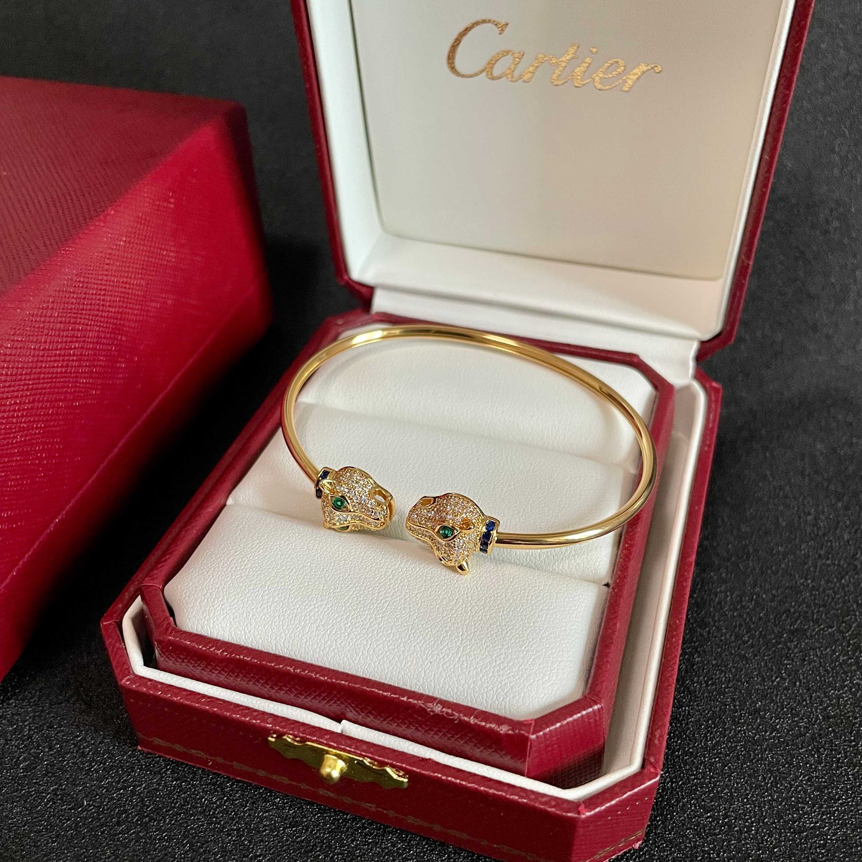 Cartier Panthere de Cartier bracelet 18k yellow gold pave clear diamonds emerald green eyes blue sapphire accents 17