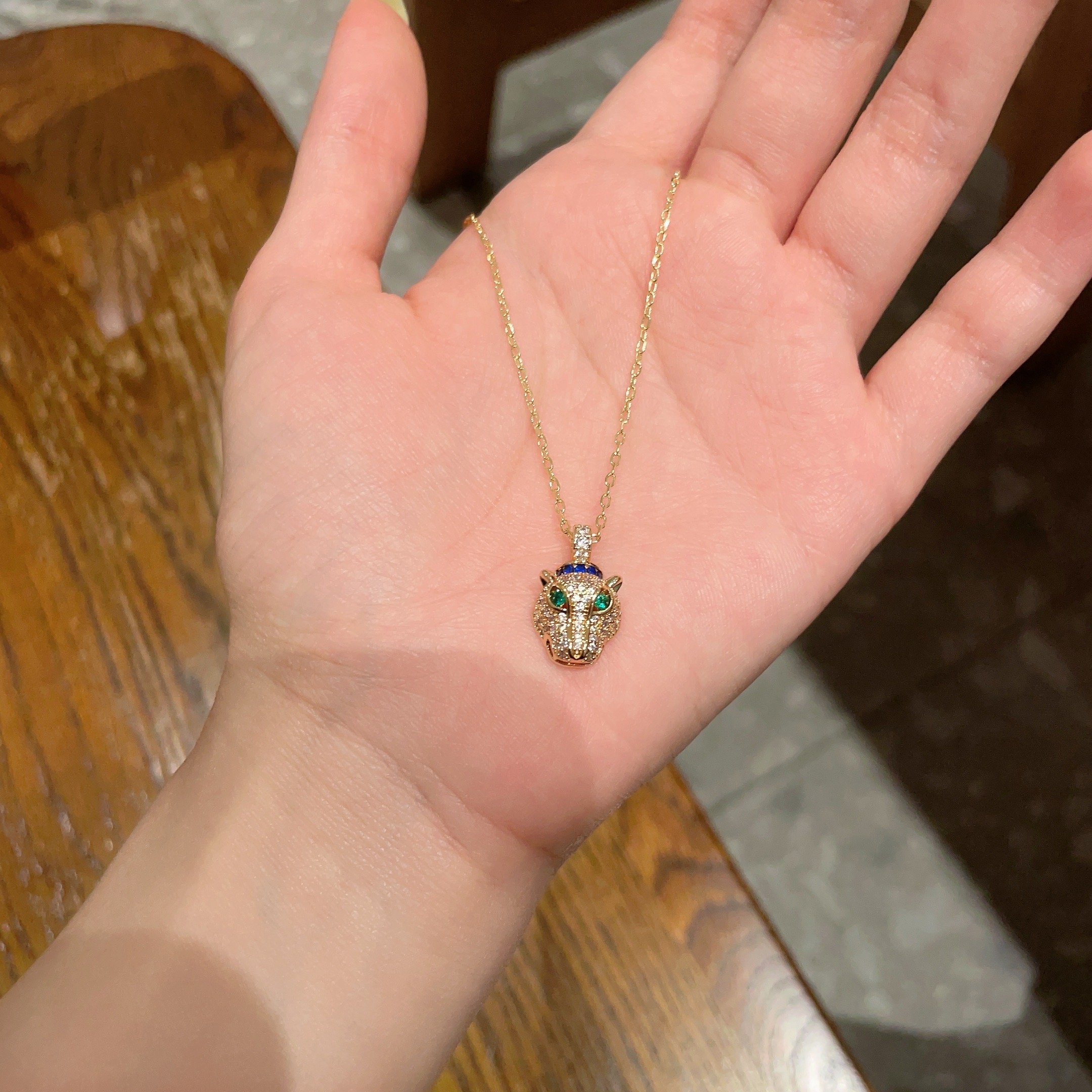 Cartier Panthere de Cartier necklace 18K yellow gold set with pave diamonds green tsavorite garnet eyes blue sapphire accents 40cm