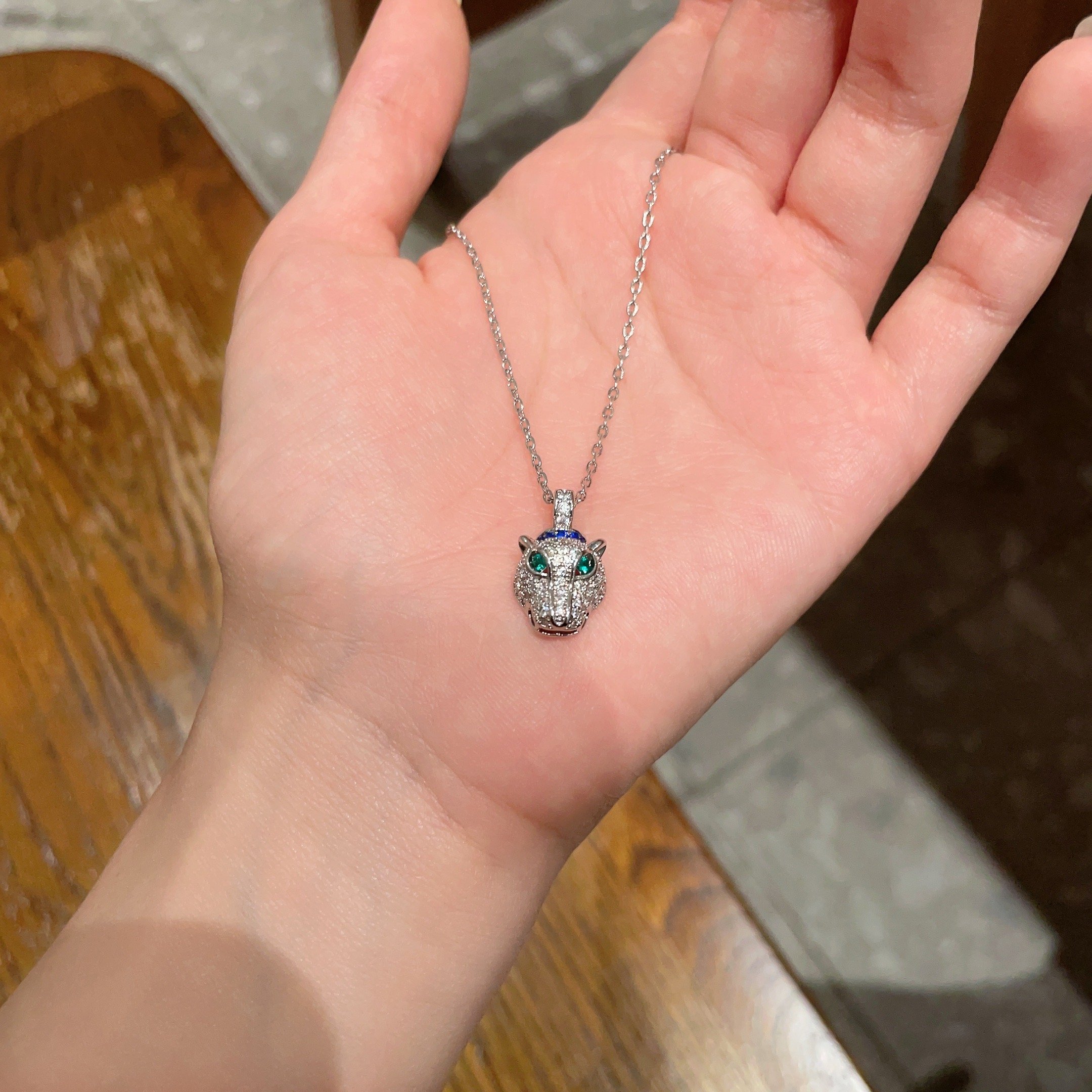 Cartier Panthere de Cartier necklace 18K white gold pave diamonds emerald eyes blue sapphire accent 42cm