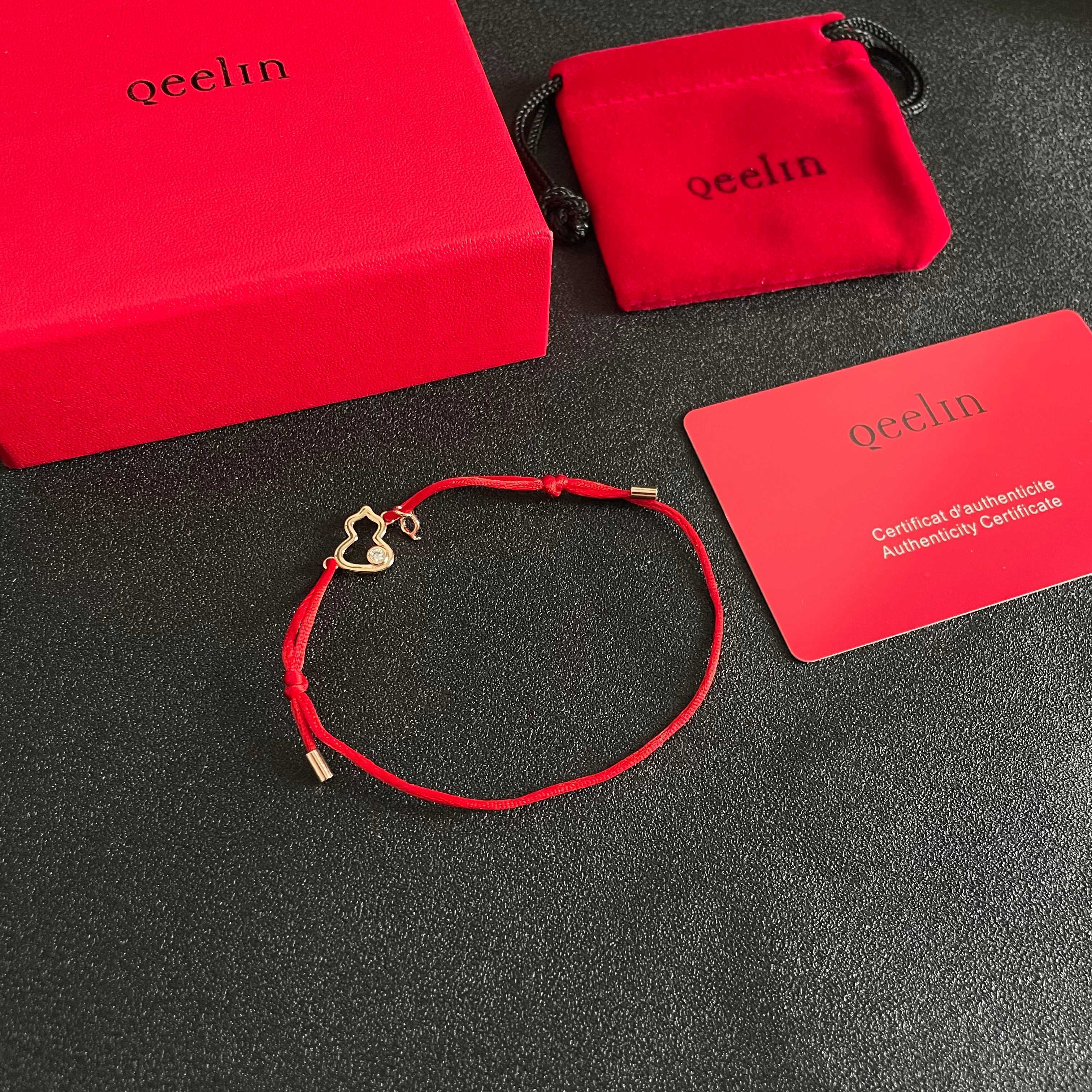 Qeelin Kirin Mini Gourd bracelet gold-toned metal clear diamond accent red cord adjustable sliding knot fits 15-19cm wrist