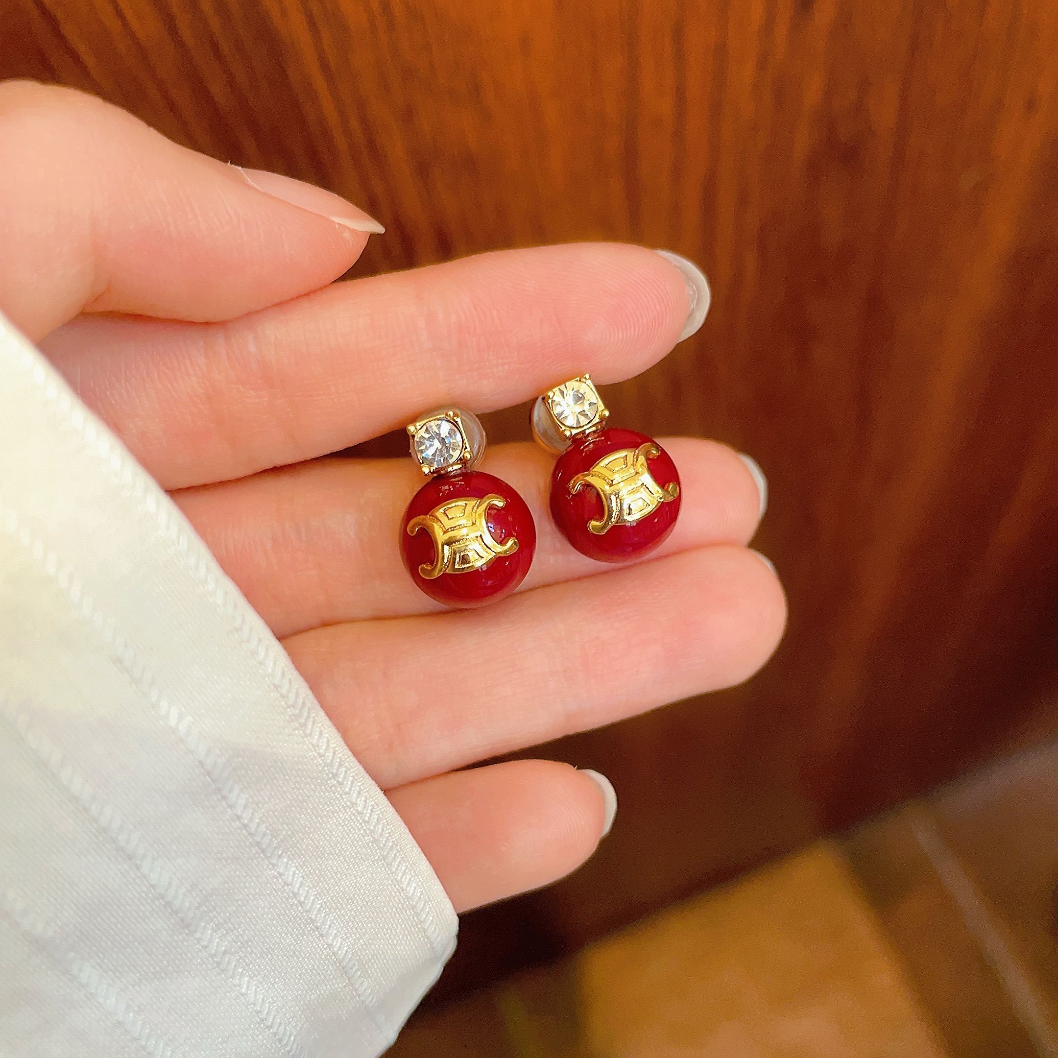 Celine Triomphe Red Bead Stud Earrings earrings gold-tone metal deep red resin bead clear faceted crystal accent 10mm bead diameter standard stud post length