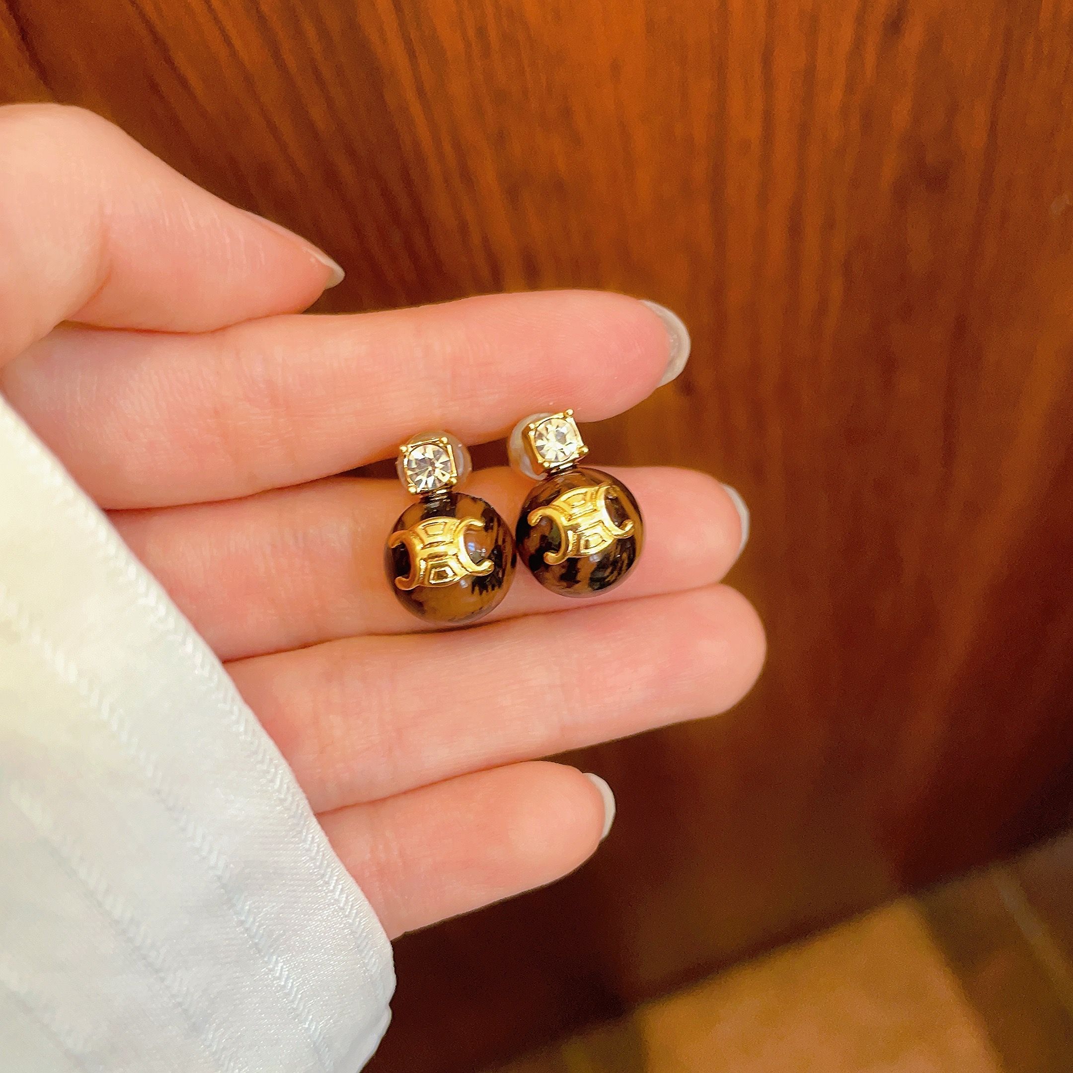 Celine Triomphe Resin Ball Stud Earrings earrings gold-tone metal tortoiseshell brown resin clear cubic zirconia accent 10mm ball diameter standard stud post length